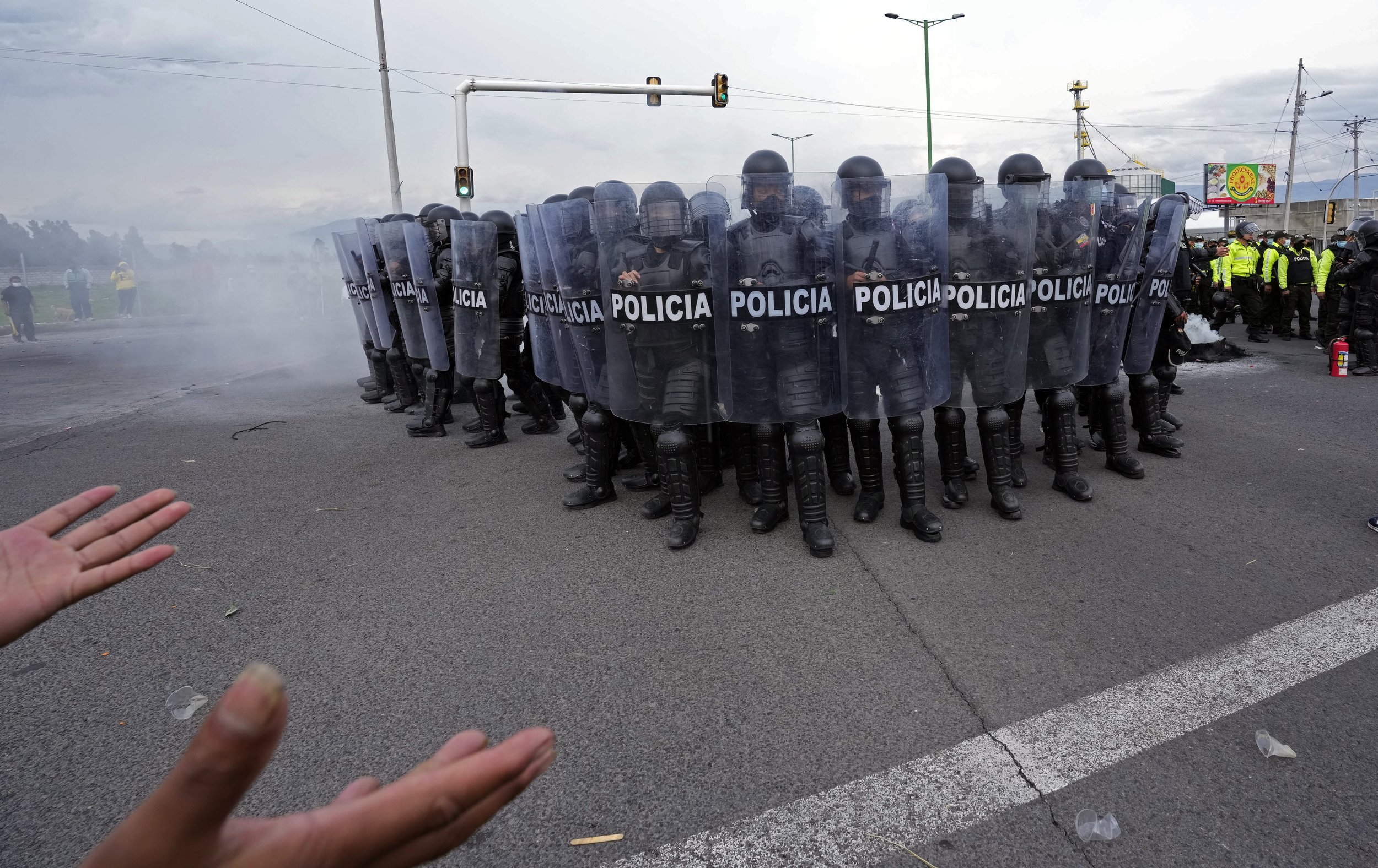  Police face off against people protesting the rise in gas prices and the policies of President Guillermo Lasso’s government in Saquisili, Ecuador, on Oct. 26, 2021. (AP Photo/Dolores Ochoa) 