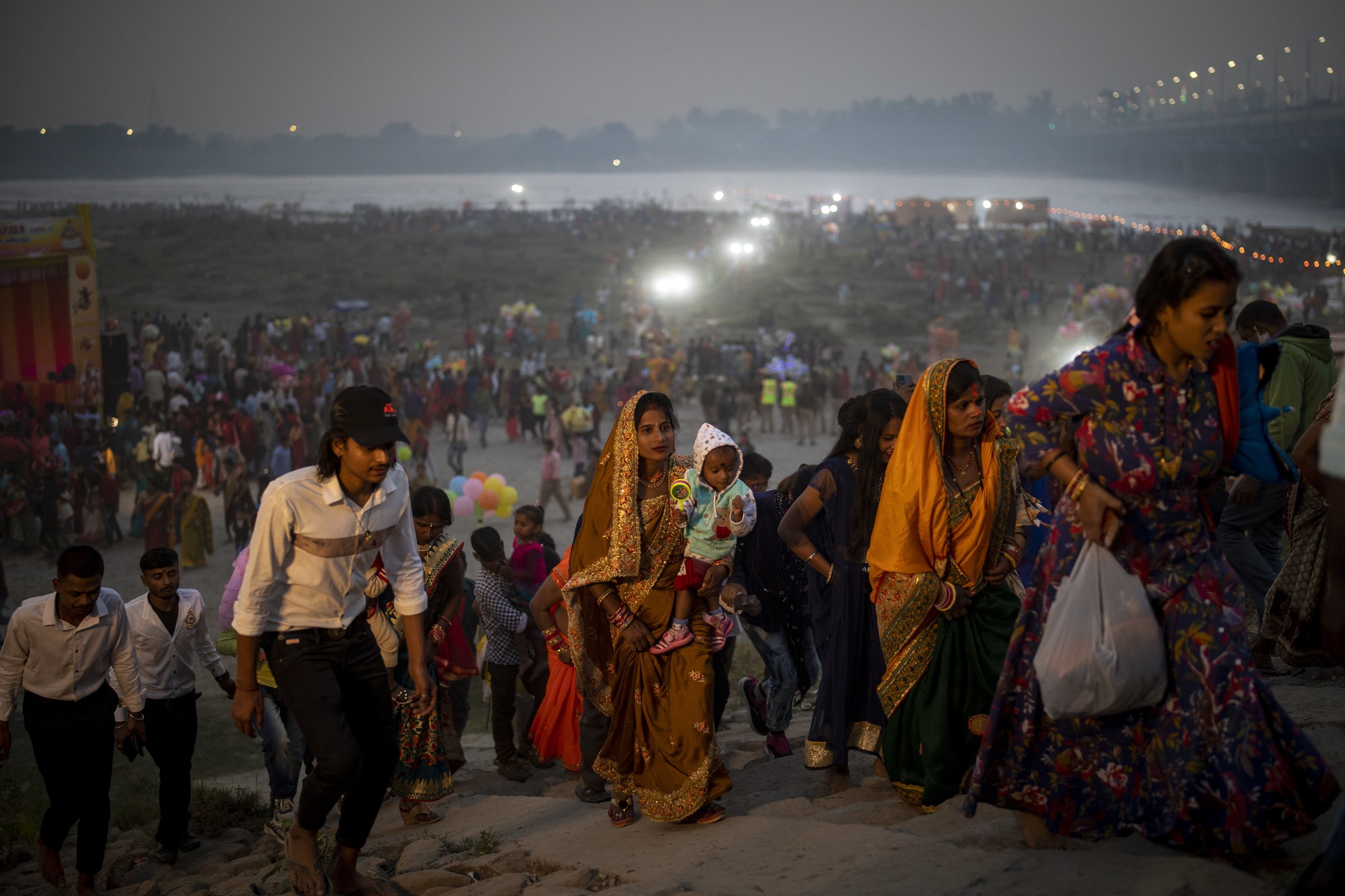  Hindu devotees leave after performing rituals on the banks of the Yamuna river in New Delhi, India, on Nov. 10, 2021, during the Chhath Puja festival, held to thank the sun god for sustaining life on earth. (AP Photo/Altaf Qadri) 