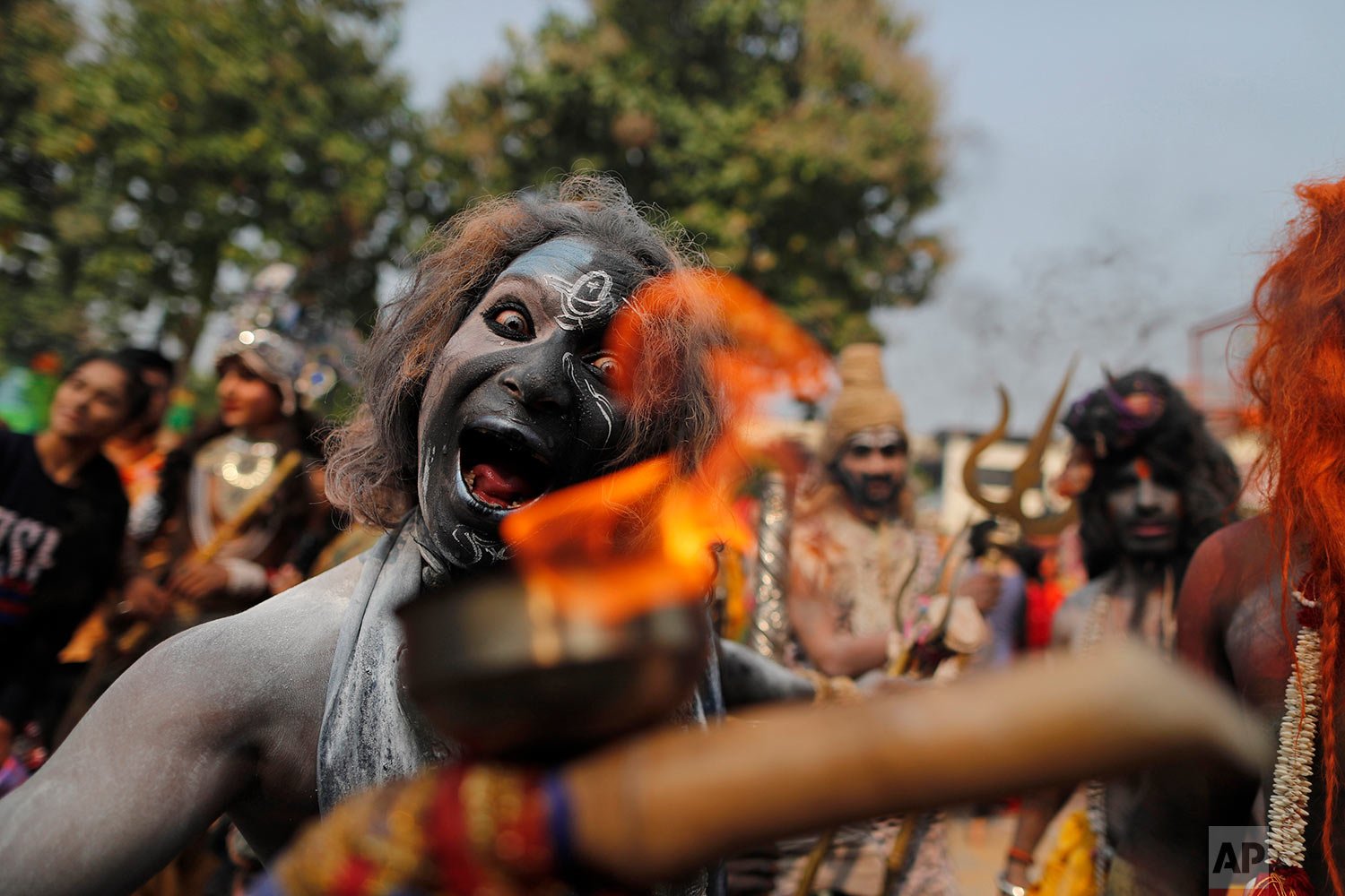  A man performs during a celebration marking  deepotsav in Ayodhya , India, Wednesday, Nov. 3, 2021.  (AP Photo/Rajesh Kumar Singh) 