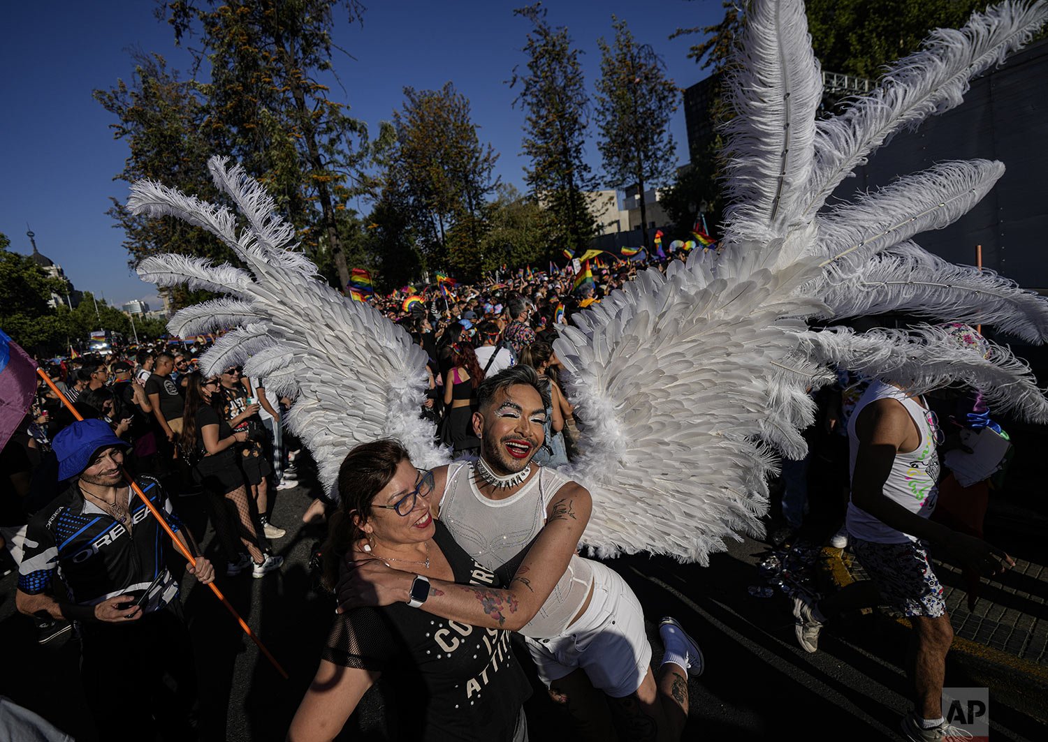  Freddy Castillo, wearing angel wings, poses for a photo during the annual Gay Pride parade in Santiago, Chile, Nov. 13, 2021. (AP Photo/Esteban Felix) 