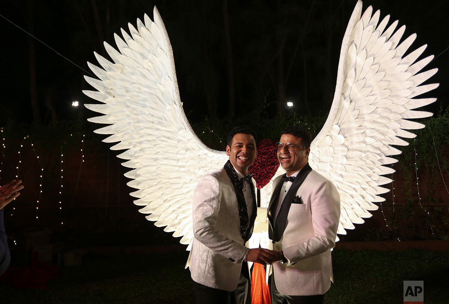  Indian gay couple Supriyo Chakraborty, left, and Abhay Dang, share a happy moment during their promising ceremony for acceptance on the outskirts of Hyderabad, India, Saturday, Dec.18, 2021. (AP Photo/Mahesh Kumar A.) 