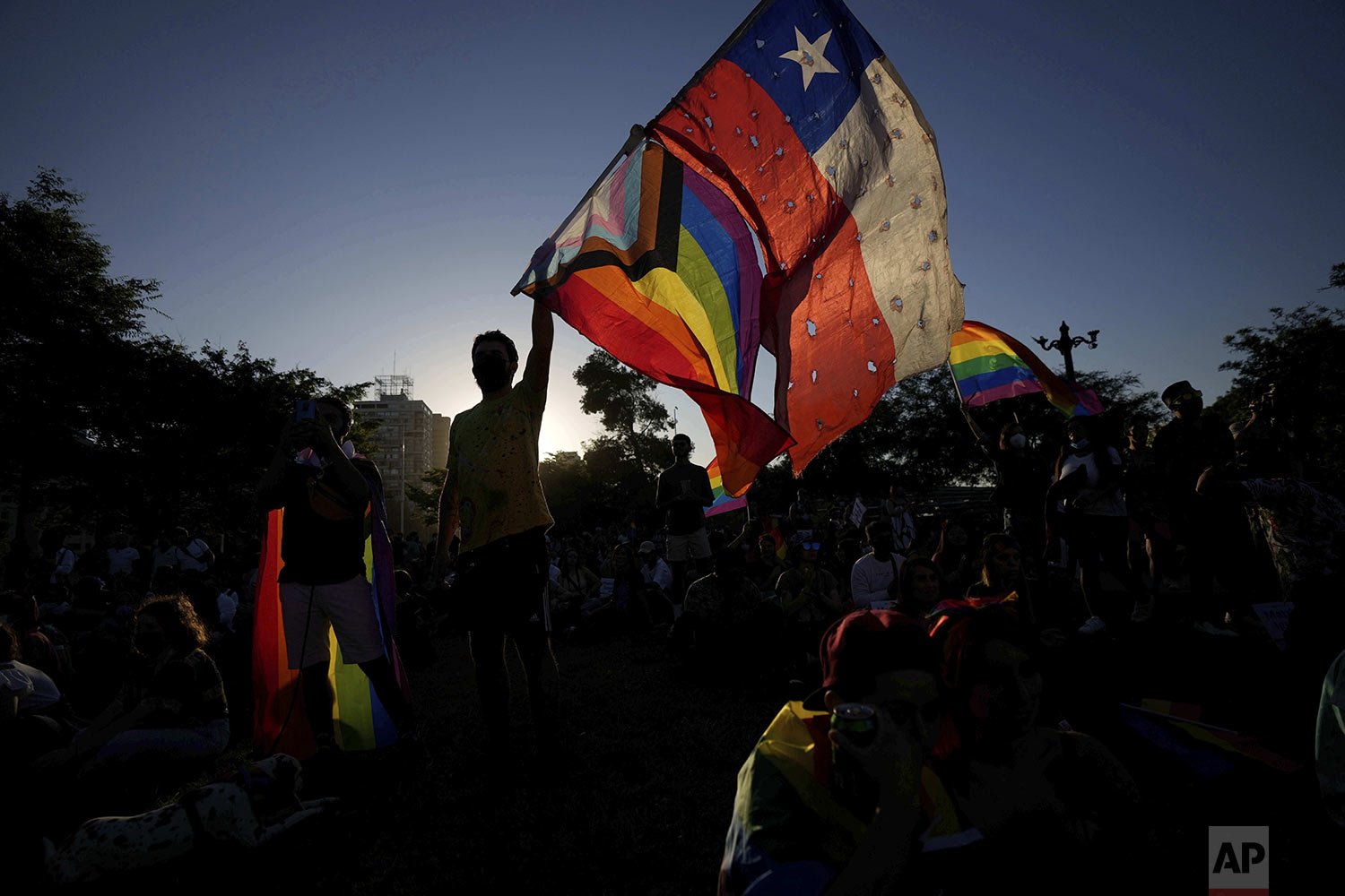  Members of the Movement for Homosexual Integration and Liberation celebrate after lawmakers approved legislation legalizing marriage and adoption by same-sex couples in Santiago, Chile, Dec. 7, 2021. (AP Photo/Esteban Felix) 