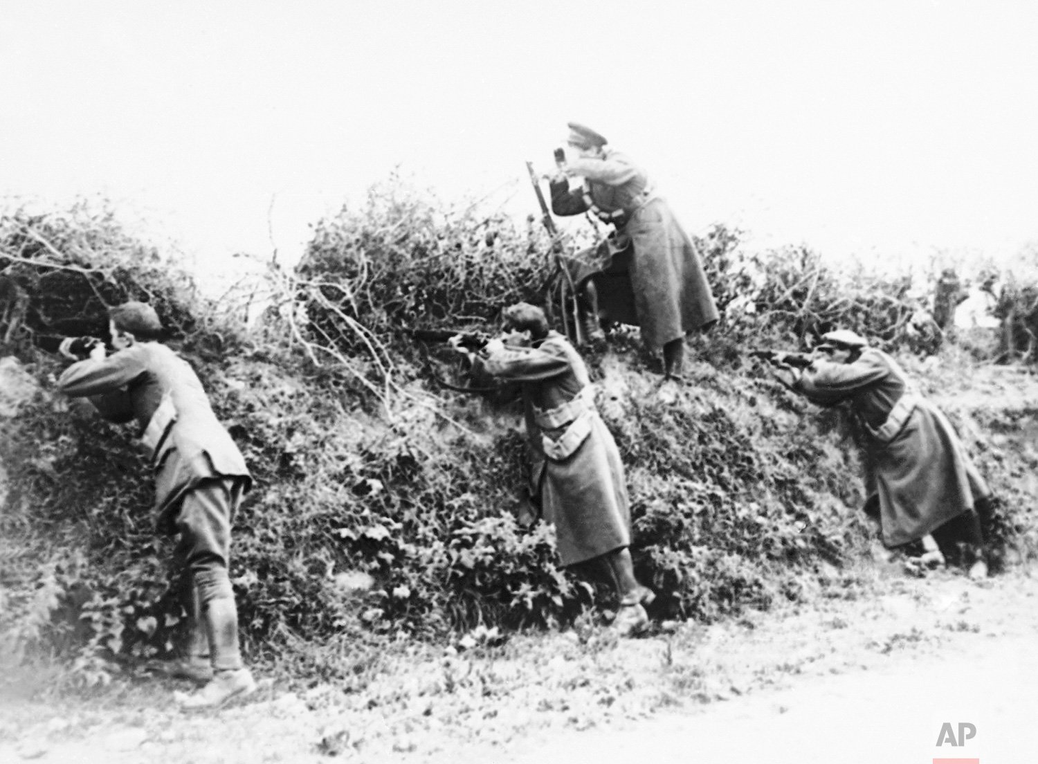  Troops firing from the shelter of a hedge in Ireland, 1922. (AP Photo) 