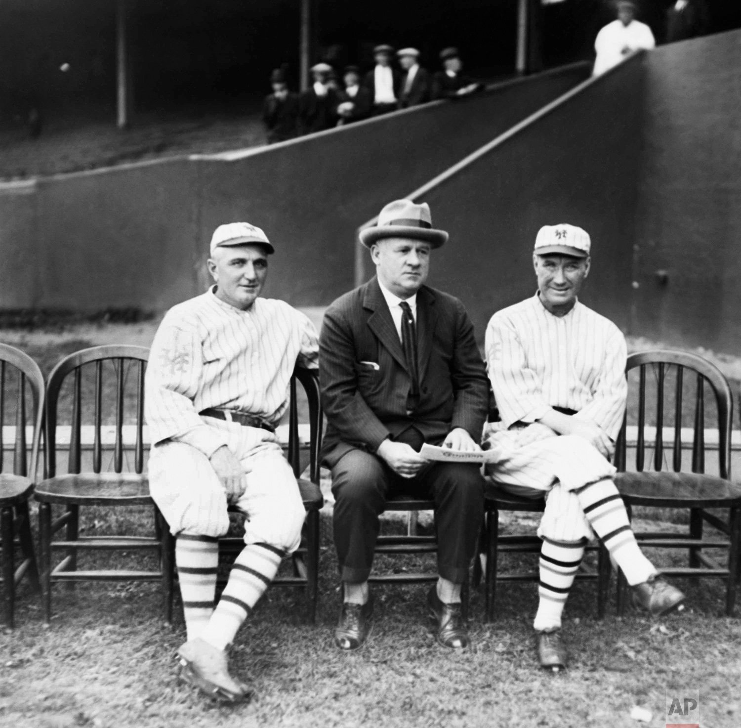  Left to right executives of the New York Giants baseball team are  Hughie Jennings, coach; John McGraw, manager; and Cozy Dolan, coach.  The New York Giants win their eigth penant on Sept. 26, 1922. (AP Photo) 