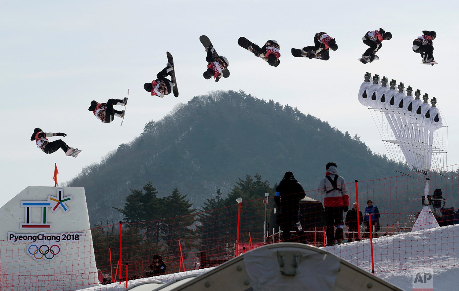  In this multiple exposure image Laurie Blouin, of Canada, jumps during qualification for the women's Big Air snowboard competition at the 2018 Winter Olympics in Pyeongchang, South Korea, on Feb. 19, 2018. (AP Photo/Dmitri Lovetsky) 