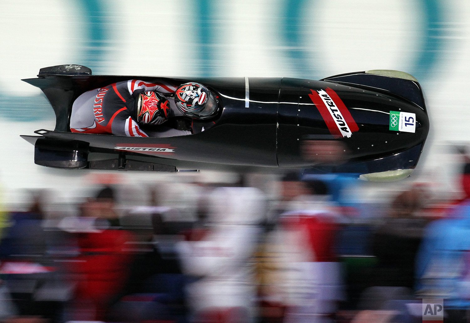  Austria's AUT-2, piloted by Juergen Loacker with brakeman Christian Hackl, competes during the men's two-man bobsled competition at the Vancouver 2010 Olympics in Whistler, British Columbia, on Feb. 20, 2010. (AP Photo/Michael Sohn) 
