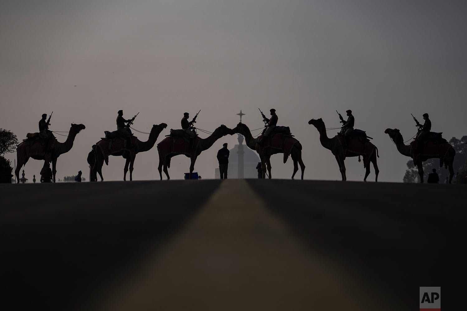  Camel-mounted soldiers stand in formation during rehearsals for the upcoming Beating Retreat ceremony at Raisina hill which houses India's most important offices and the presidential palace in New Delhi, India, Wednesday, Jan. 19, 2022. (AP Photo/Al