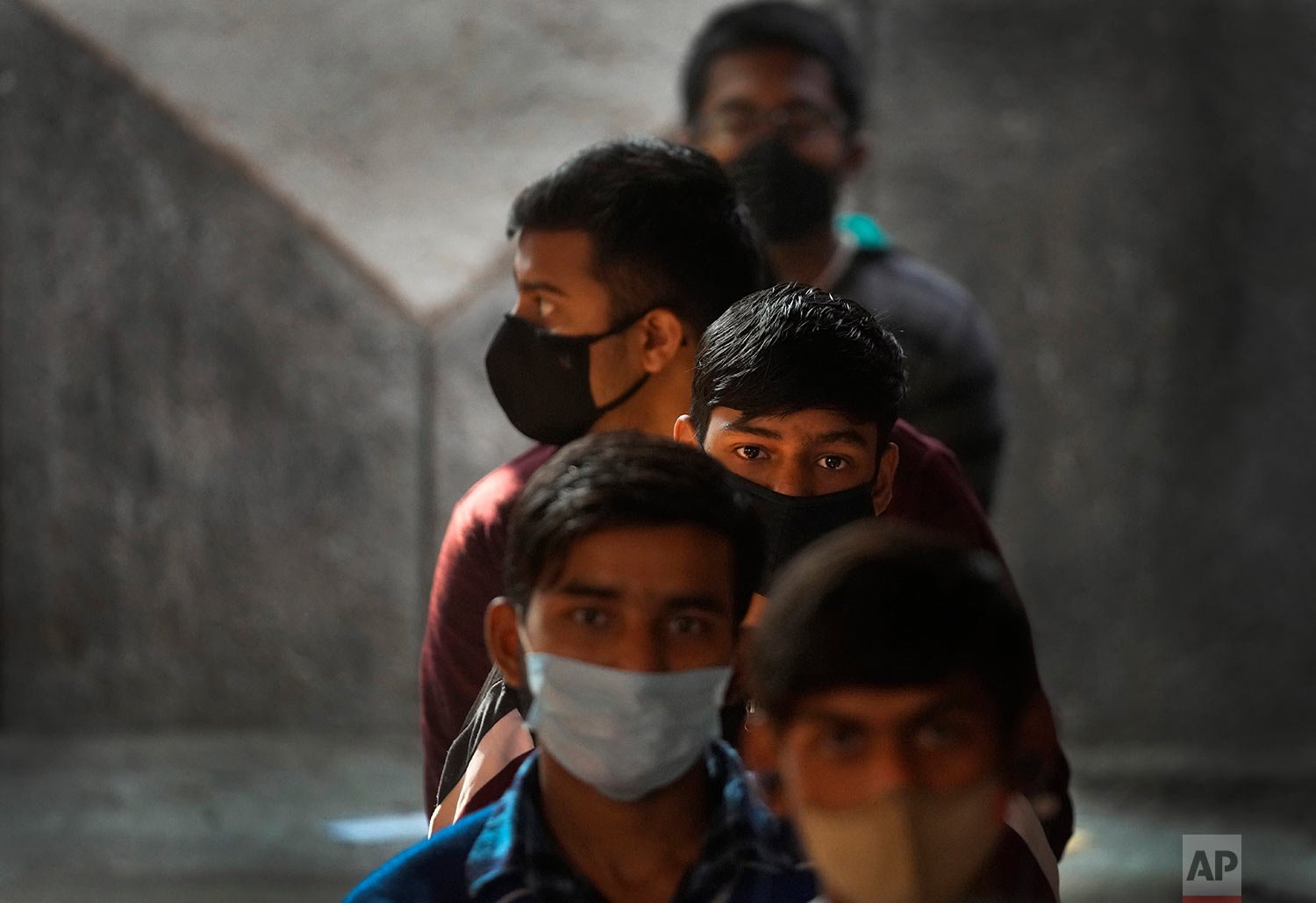  Children wait to receive their COVID-19 vaccines at a government school in New Delhi, India, Monday, Jan. 3, 2022.  (AP Photo/Manish Swarup) 