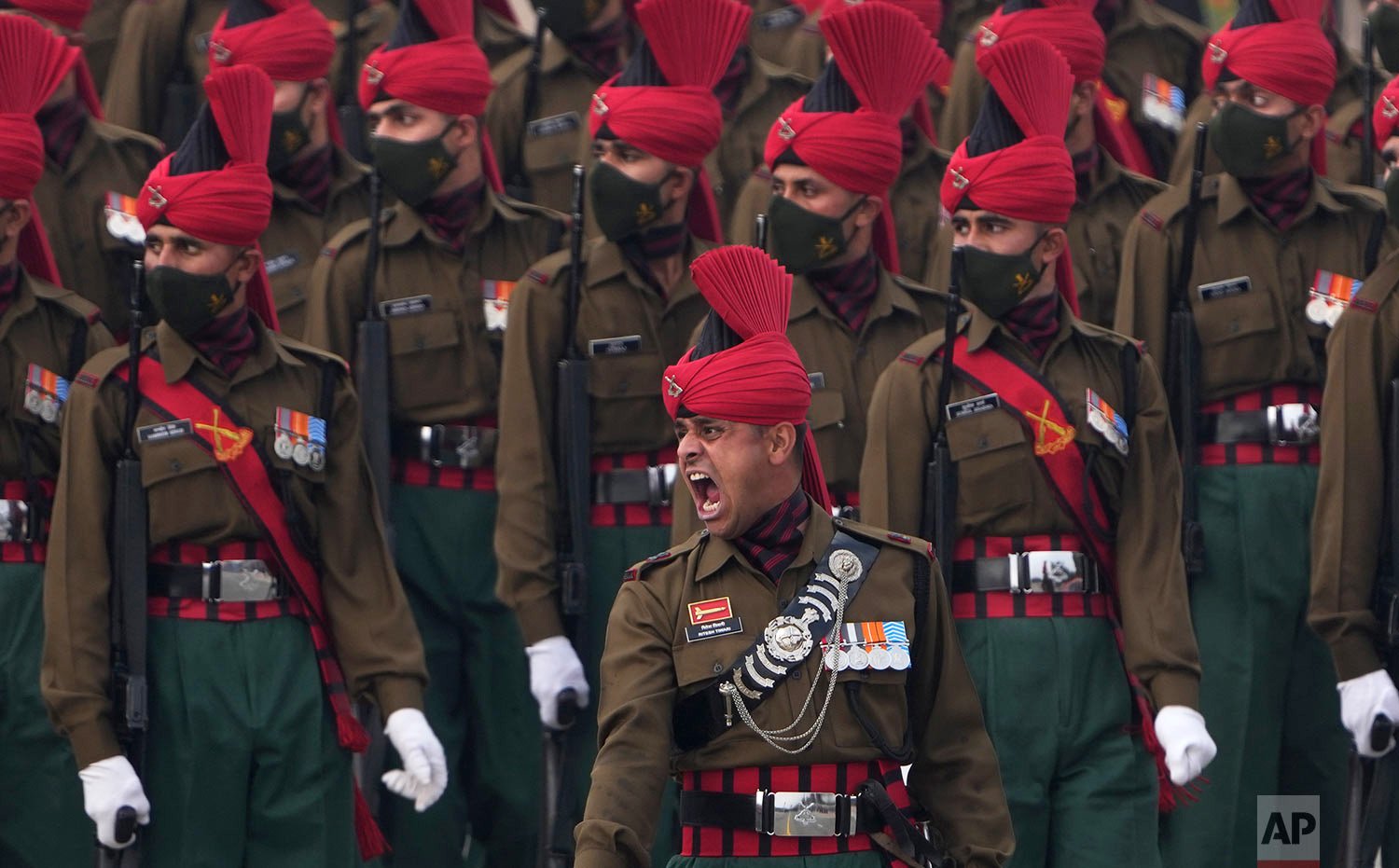  Indian army soldiers march through the ceremonial Rajpath boulevard during India's Republic Day celebrations, in New Delhi, India, Wednesday, Jan. 26, 2022.  (AP Photo/Manish Swarup) 