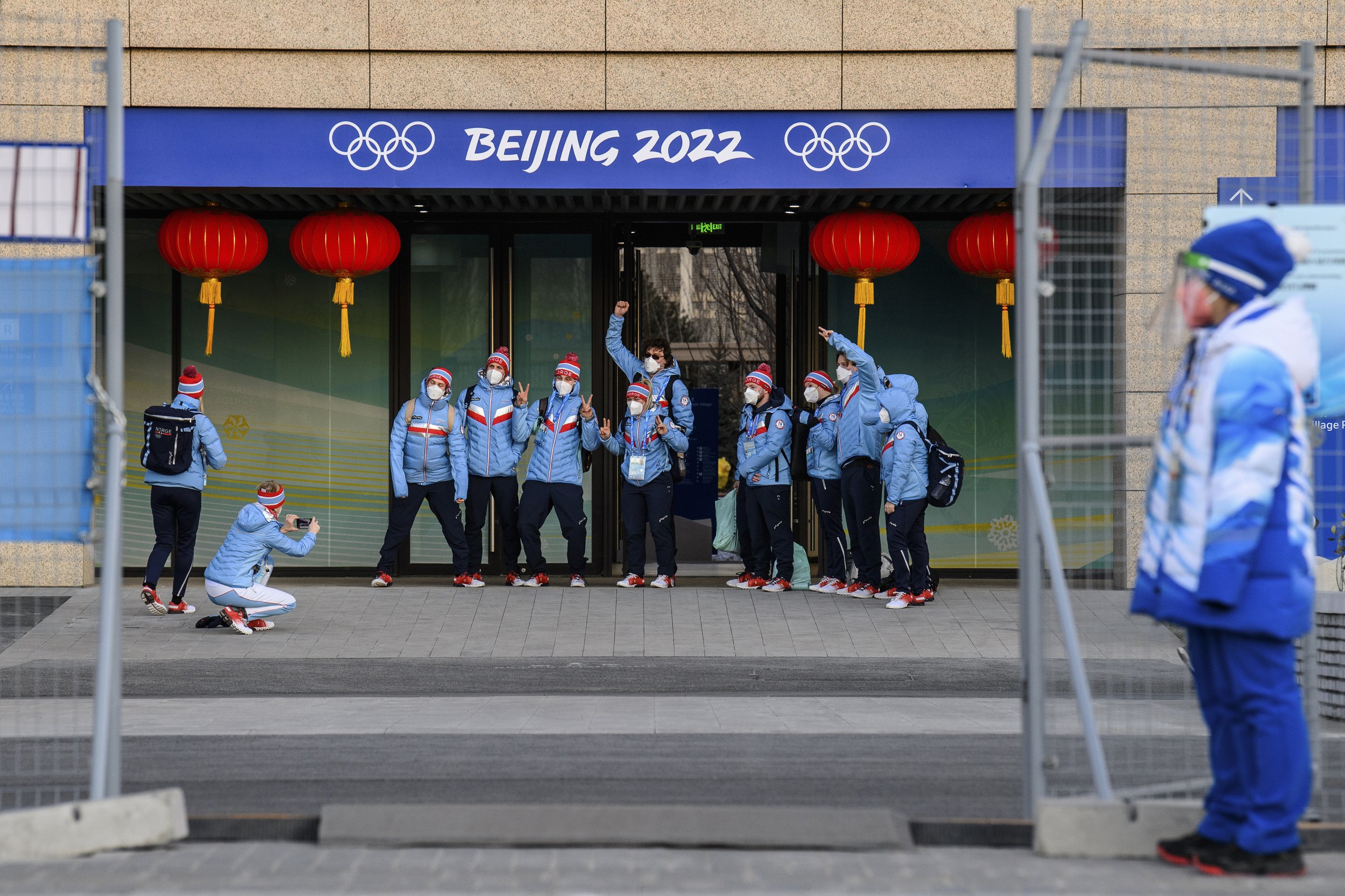  Members of Team Norway stand for photographs after entering the gate of the Olympic Village ahead of the 2022 Winter Olympics, Tuesday, Feb. 1, 2022, in Beijing. (Anthony Wallace/Pool Photo via AP) 