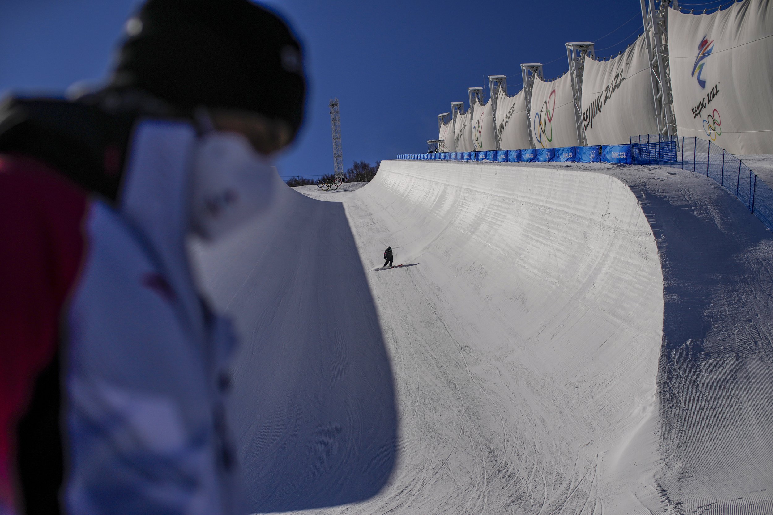  A skier trains on the half-pipe ahead of the 2022 Winter Olympics, Tuesday, Feb. 1, 2022, in Zhangjiakou, China. (AP Photo/Francisco Seco) 