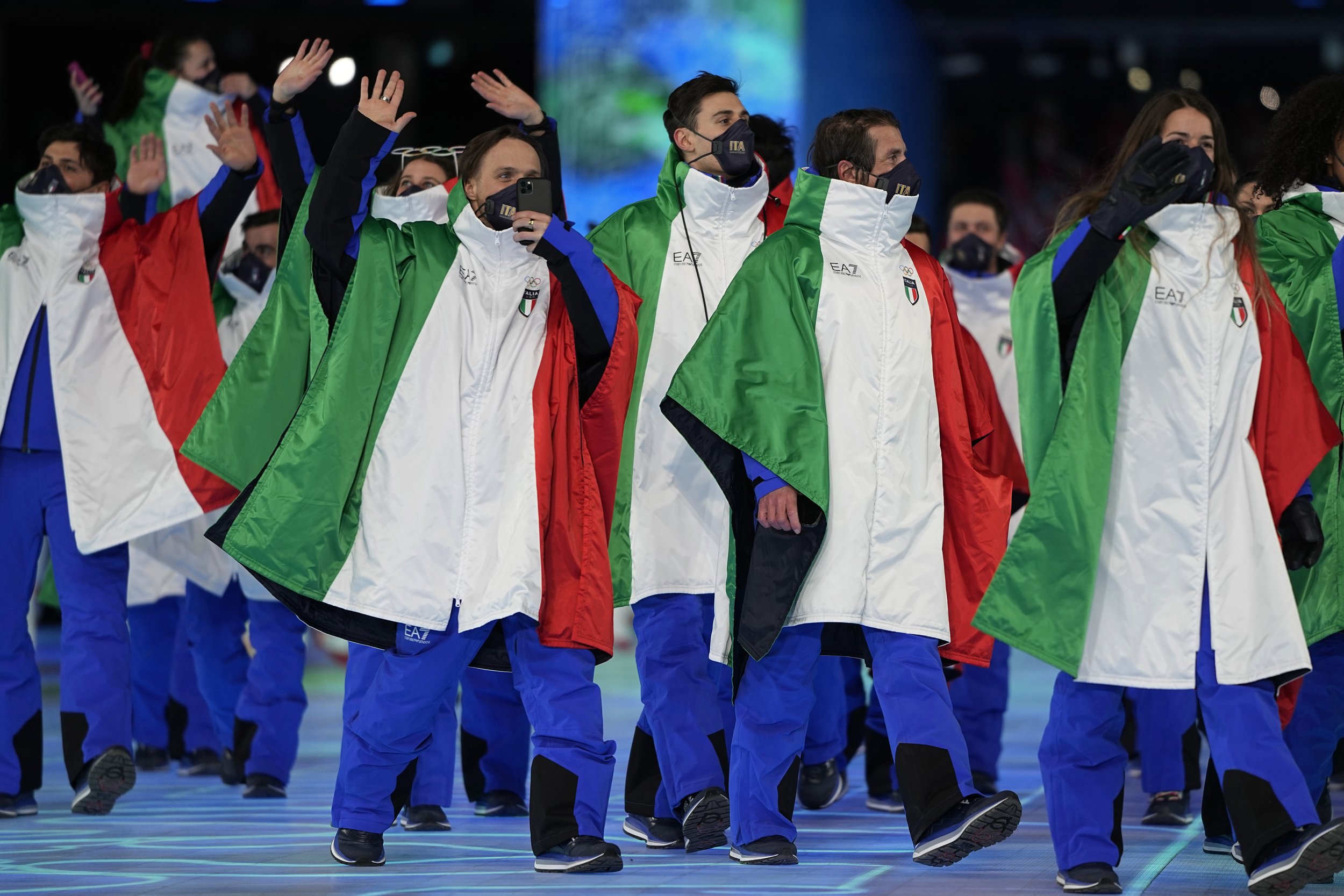  Italian athletes walk into the stadium during the opening ceremony of the 2022 Winter Olympics, Friday, Feb. 4, 2022, in Beijing. (AP Photo/Jae C. Hong) 