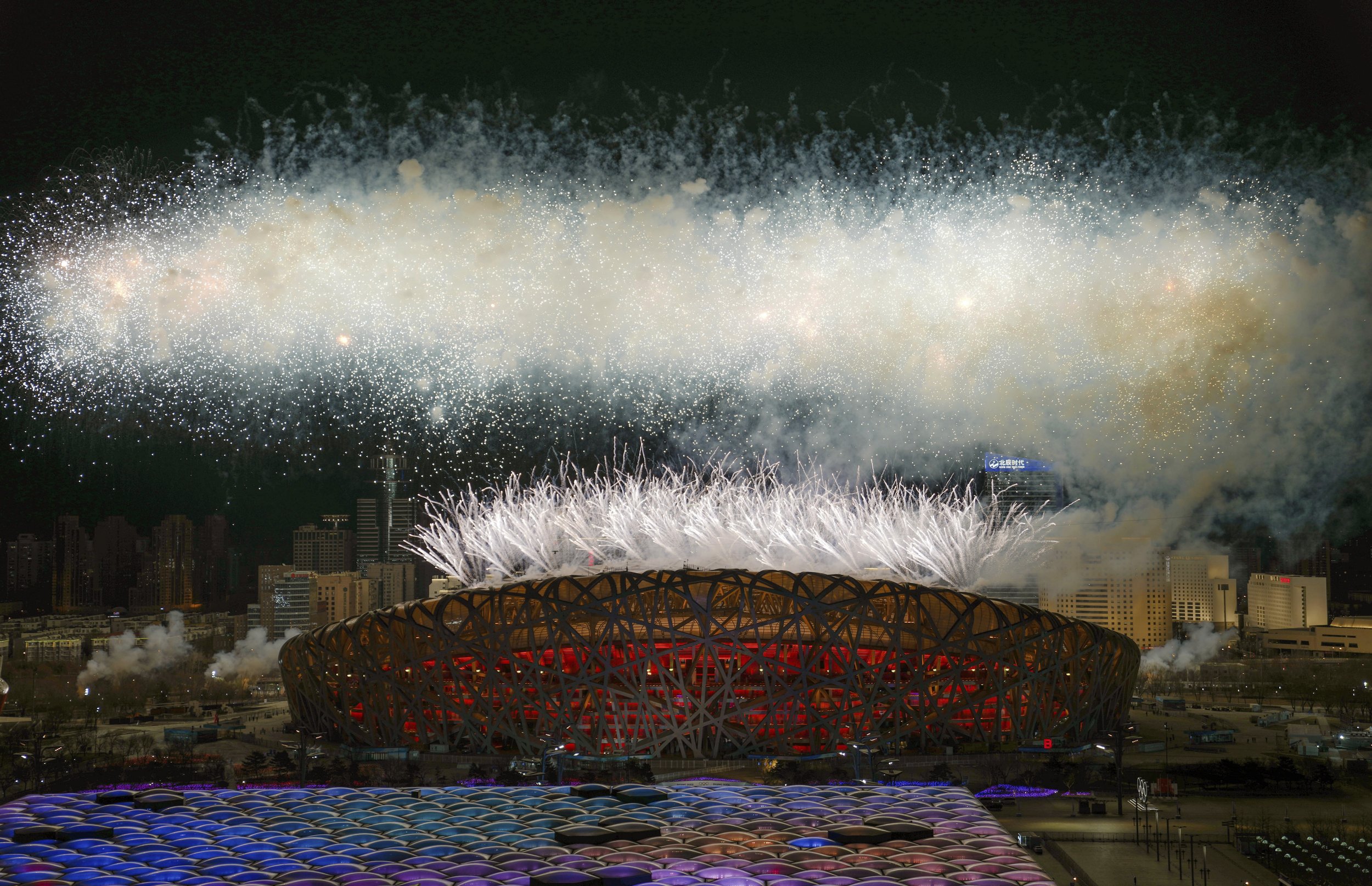  Fireworks illuminate the night sky during the opening ceremony of the 2022 Winter Olympics, Friday, Feb. 4, 2022, in Beijing.  (Xing Guangli/Pool Photo via AP) 