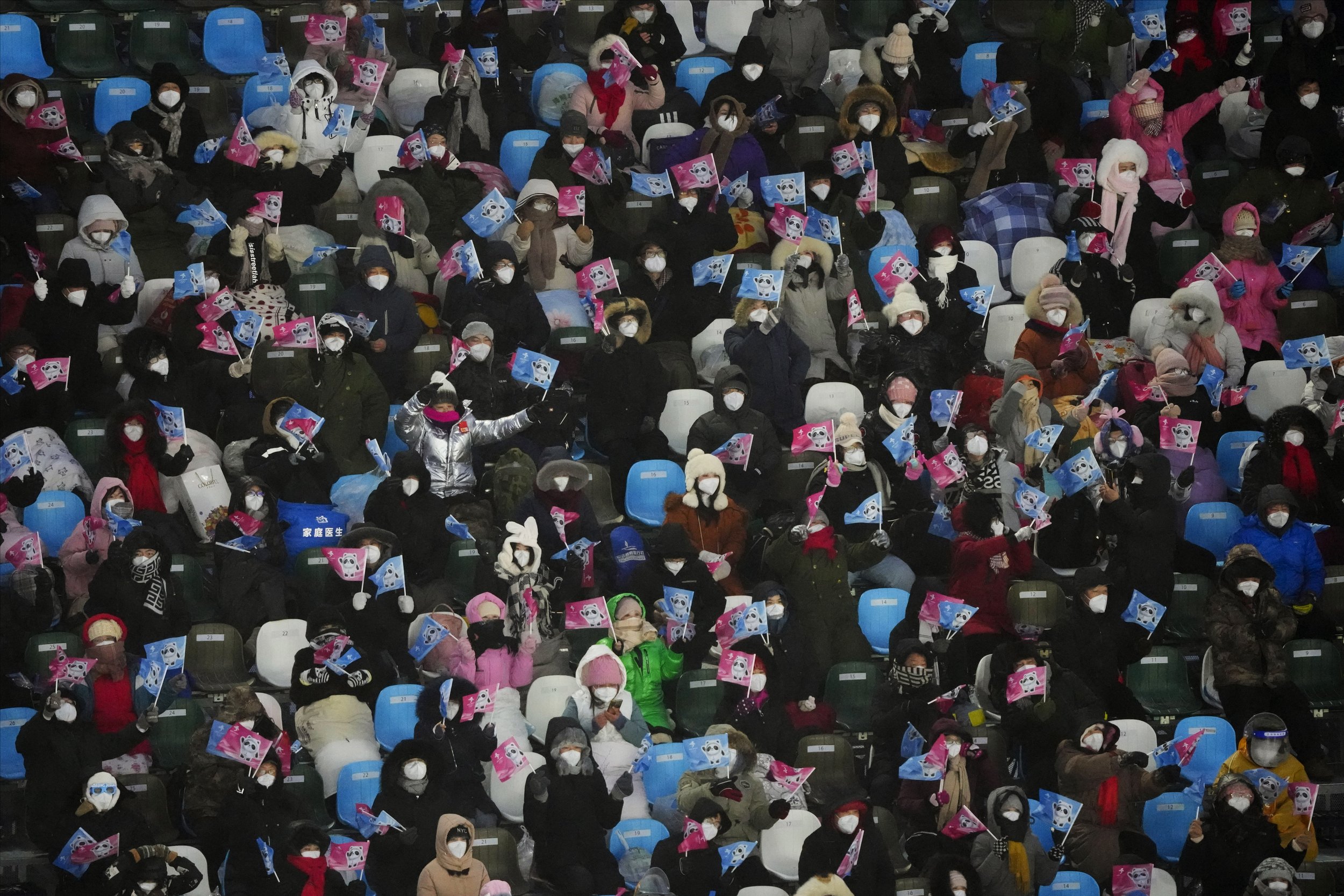  Spectators fill the stands before the women's moguls qualifying at Genting Snow Park at the 2022 Winter Olympics, Thursday, Feb. 3, 2022, in Zhangjiakou, China. (AP Photo/Lee Jin-man) 