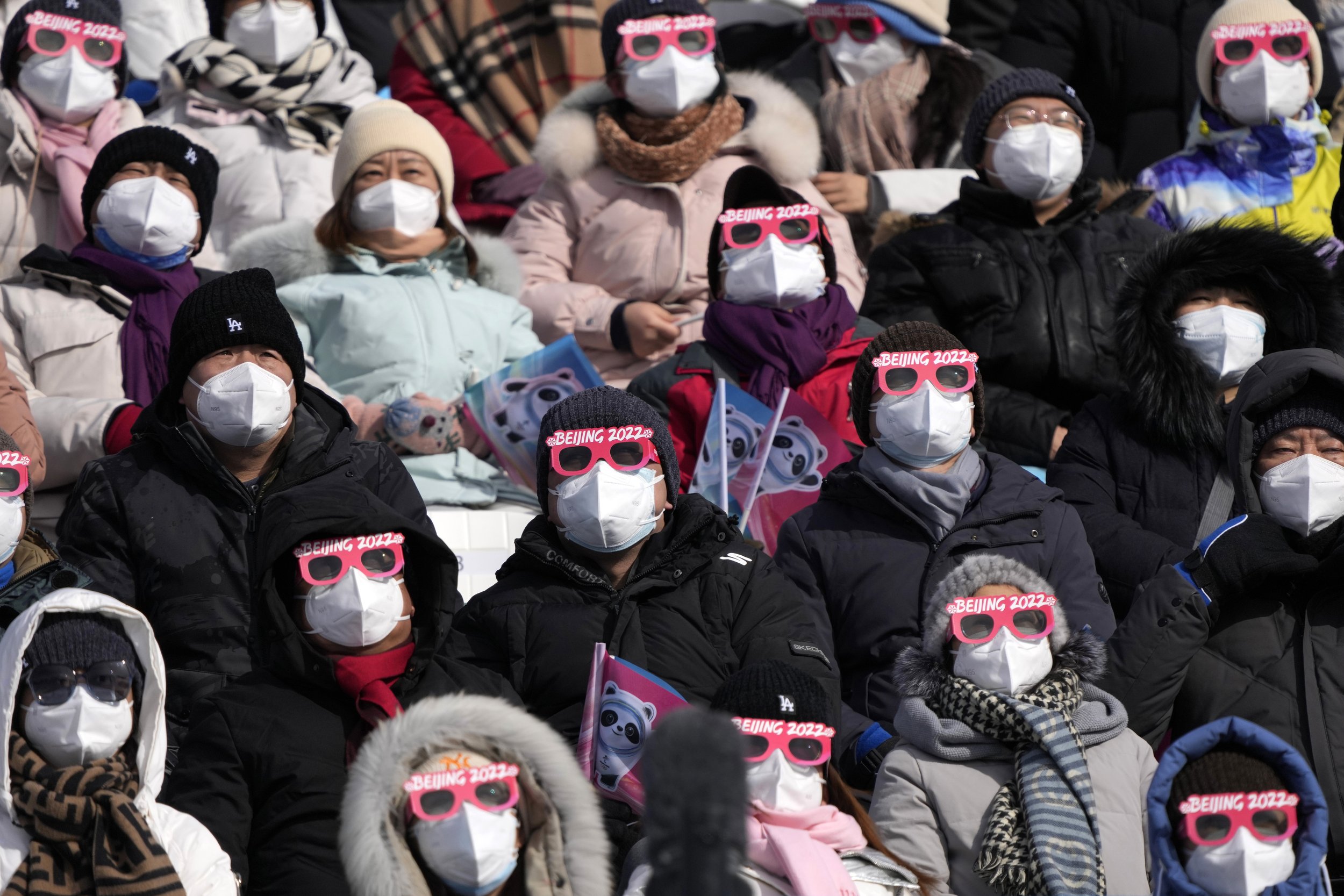  Spectators watch during men's slopestyle finals at the 2022 Winter Olympics, Monday, Feb. 7, 2022, in Zhangjiakou, China. (AP Photo/Lee Jin-man) 
