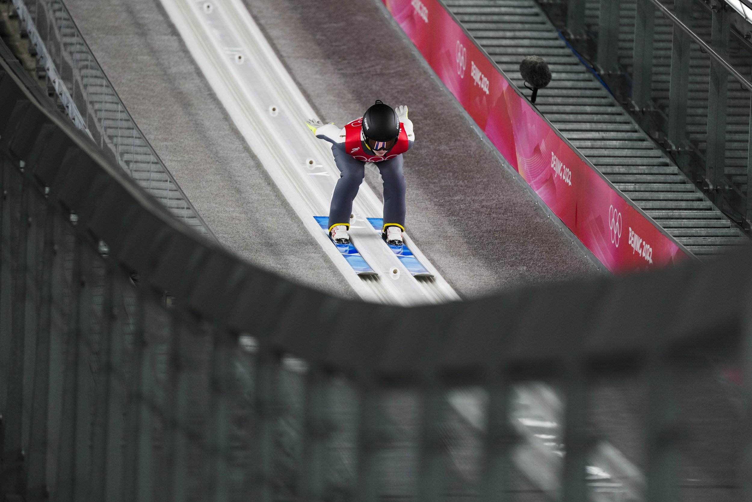  Irma Makhinia, of the Russian Olympic Committee, speeds down the hill during the mixed team trial round at the 2022 Winter Olympics, Monday, Feb. 7, 2022, in Zhangjiakou, China. (AP Photo/Andrew Medichini) 