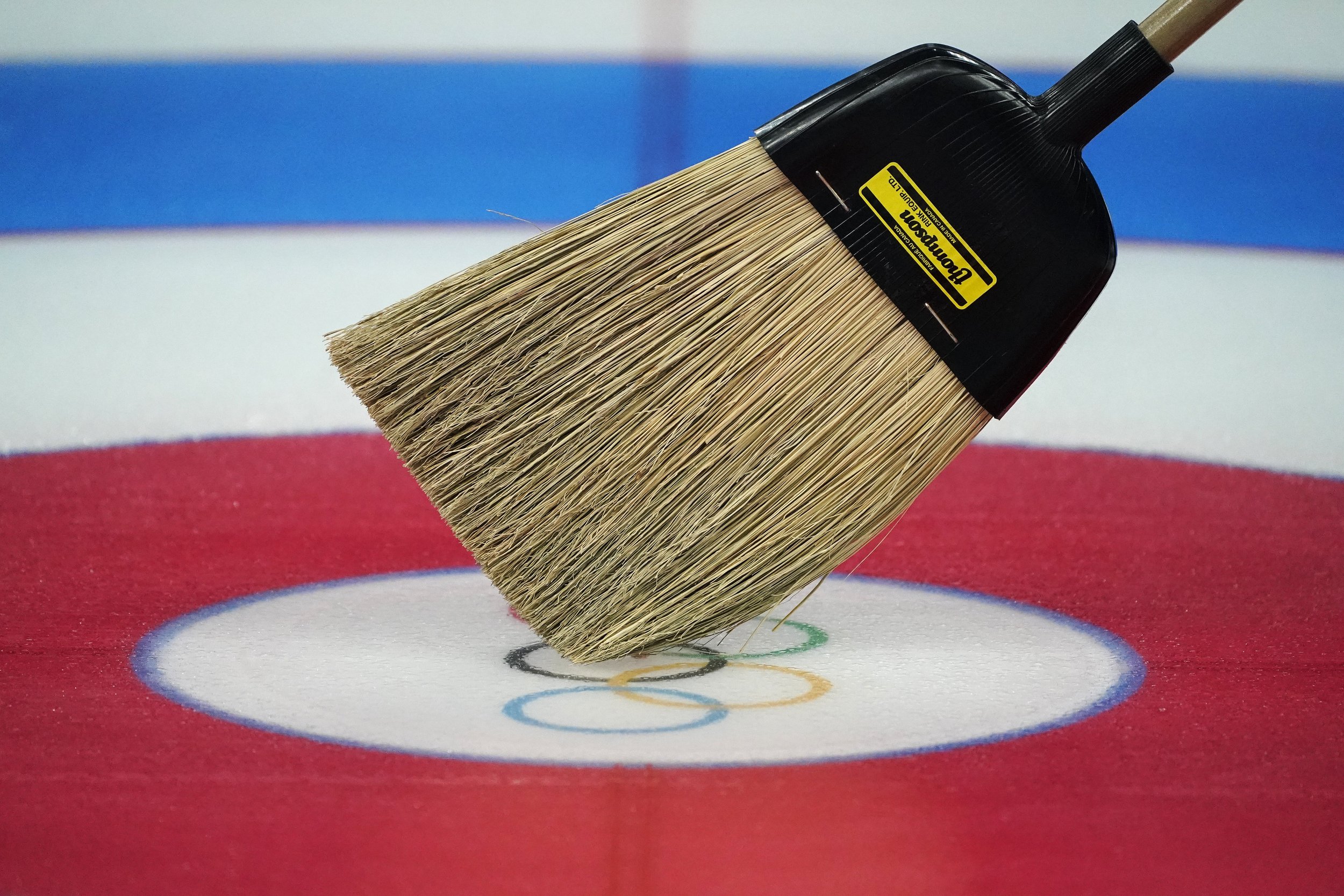  A broom is used for target guidance at the curling venue ahead of the Beijing Winter Olympics Tuesday, Feb. 1, 2022, in Beijing. (AP Photo/Brynn Anderson) 