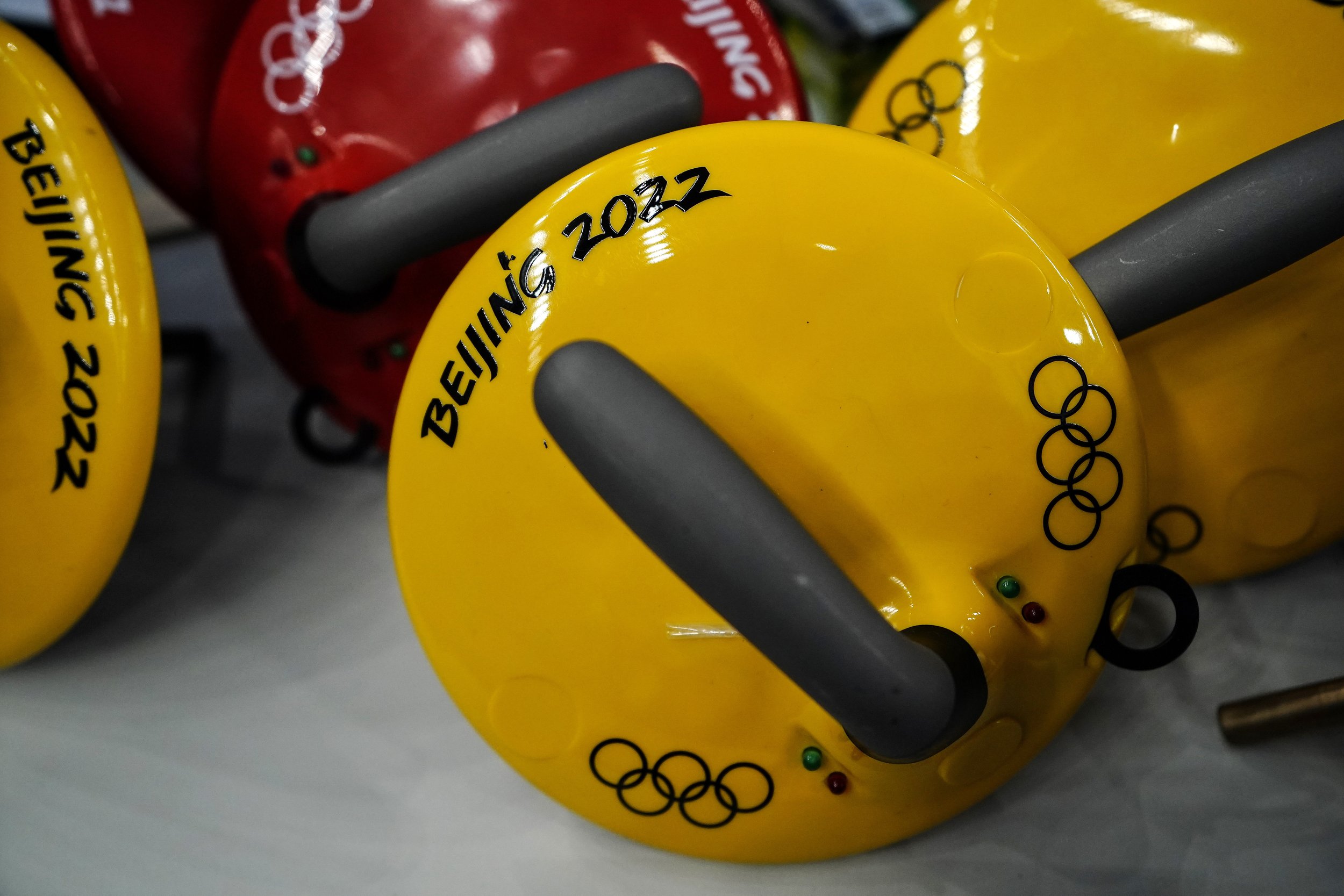  The Olympic rings are seen on a curling stone ahead of the Beijing Winter Olympics Wednesday, Feb. 2, 2022, in Beijing. (AP Photo/Brynn Anderson) 
