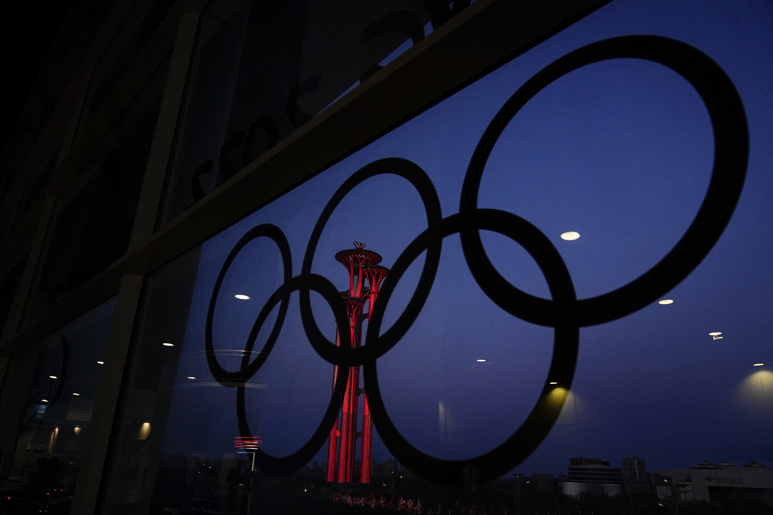  The Beijing Olympic Tower is displayed inside the Olympic rings at the main media center ahead of the Beijing Winter Olympics Monday, Jan. 31, 2022, in Beijing. (AP Photo/Brynn Anderson) 