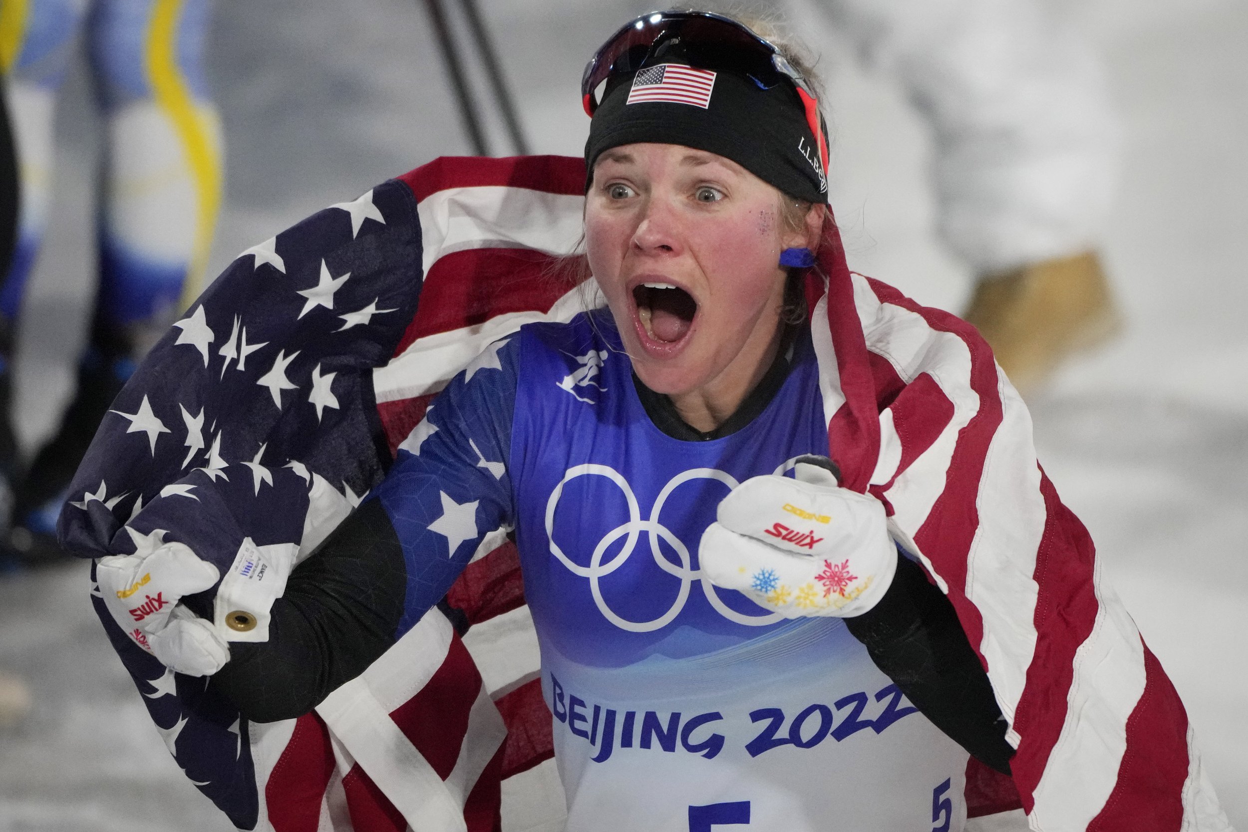  Jessie Diggins reacts after winning a bronze medal in the women's sprint free cross-country skiing competition at the 2022 Winter Olympics, Tuesday, Feb. 8, 2022, in Zhangjiakou, China. (AP Photo/Aaron Favila) 