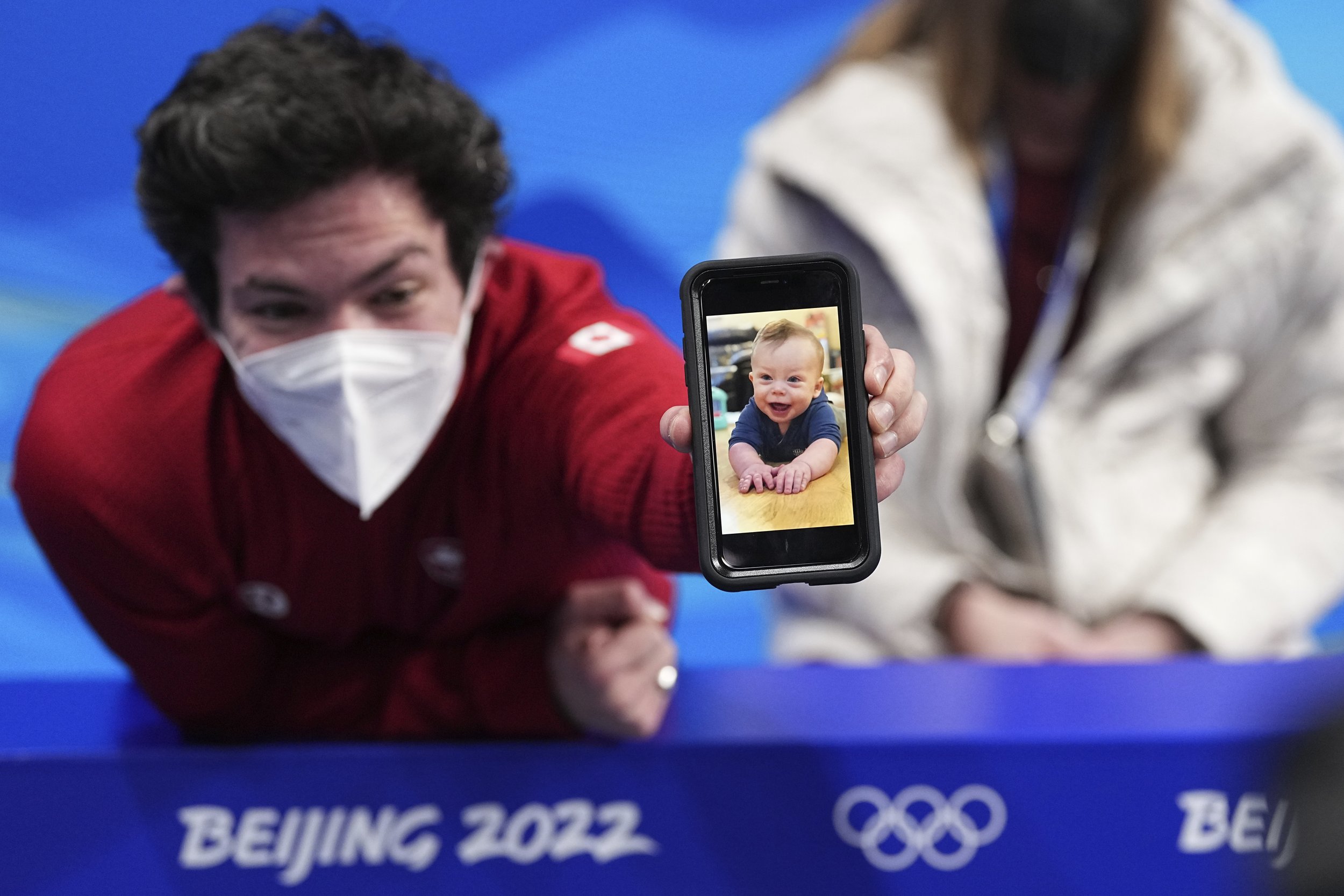  Keegan Messing, of Canada, reacts after the men's short program figure skating competition at the 2022 Winter Olympics, Tuesday, Feb. 8, 2022, in Beijing. (AP Photo/David J. Phillip) 