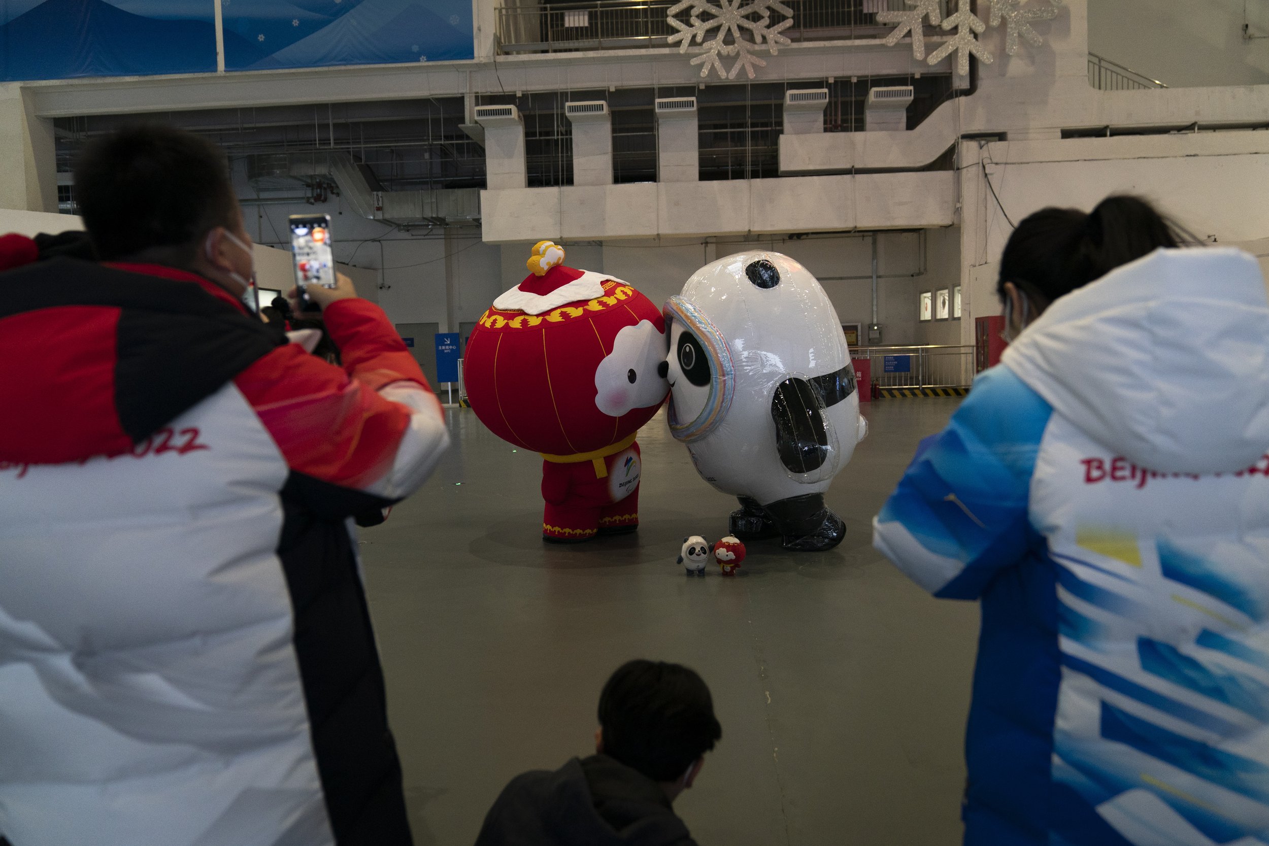  Inflated Winter Olympic and Paralympic mascots, Bing Dwen Dwen, center right, and Shuey Rhon Rhon pose for photos at the main media center at the 2022 Winter Olympics, Jan. 24, 2022, in Beijing. (AP Photo/Jae C. Hong) 