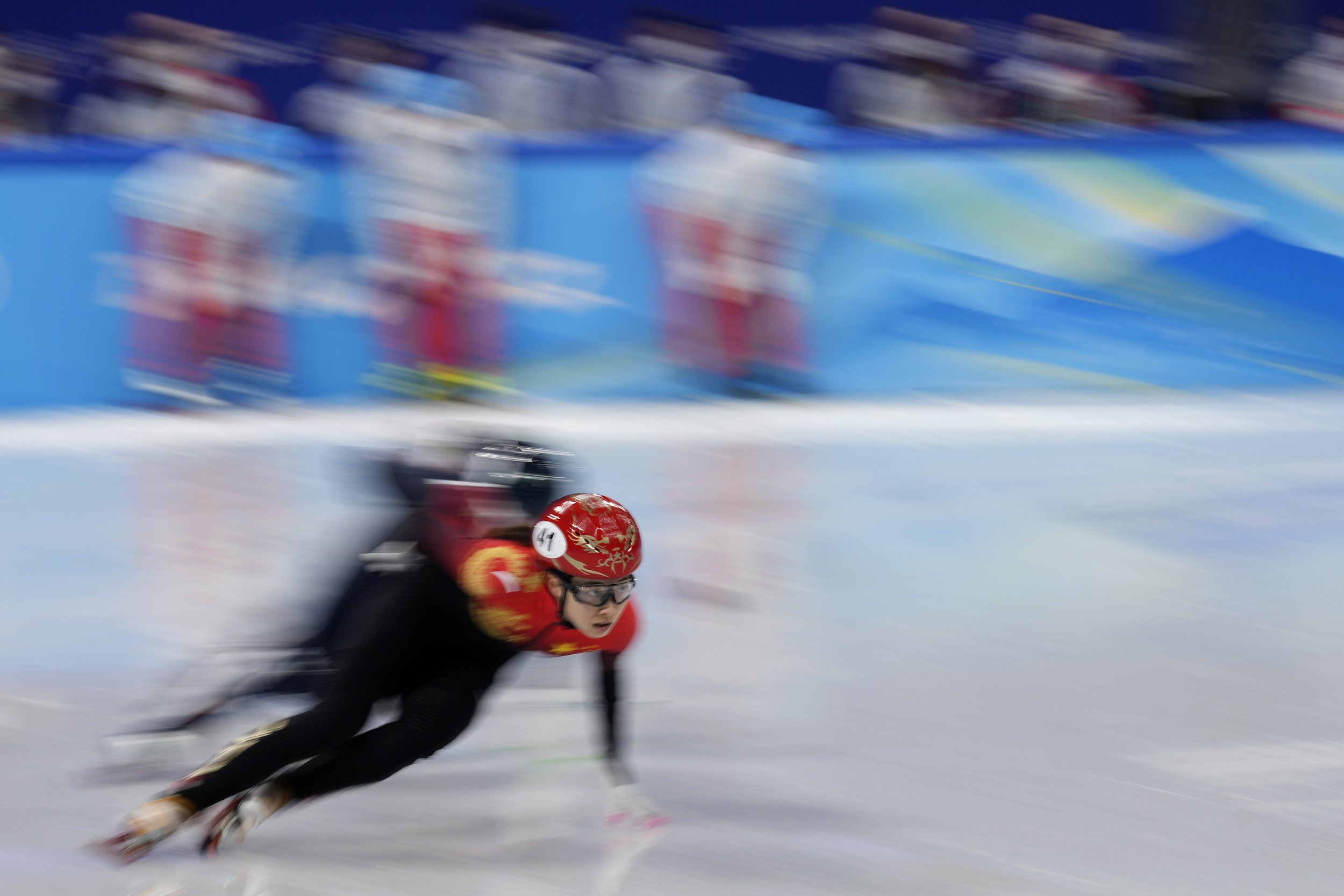  Qu Chunyu of China, races in her heat of the women's 1000-meters during the short track speedskating competition at the 2022 Winter Olympics, Wednesday, Feb. 9, 2022, in Beijing. (AP Photo/Bernat Armangue) 