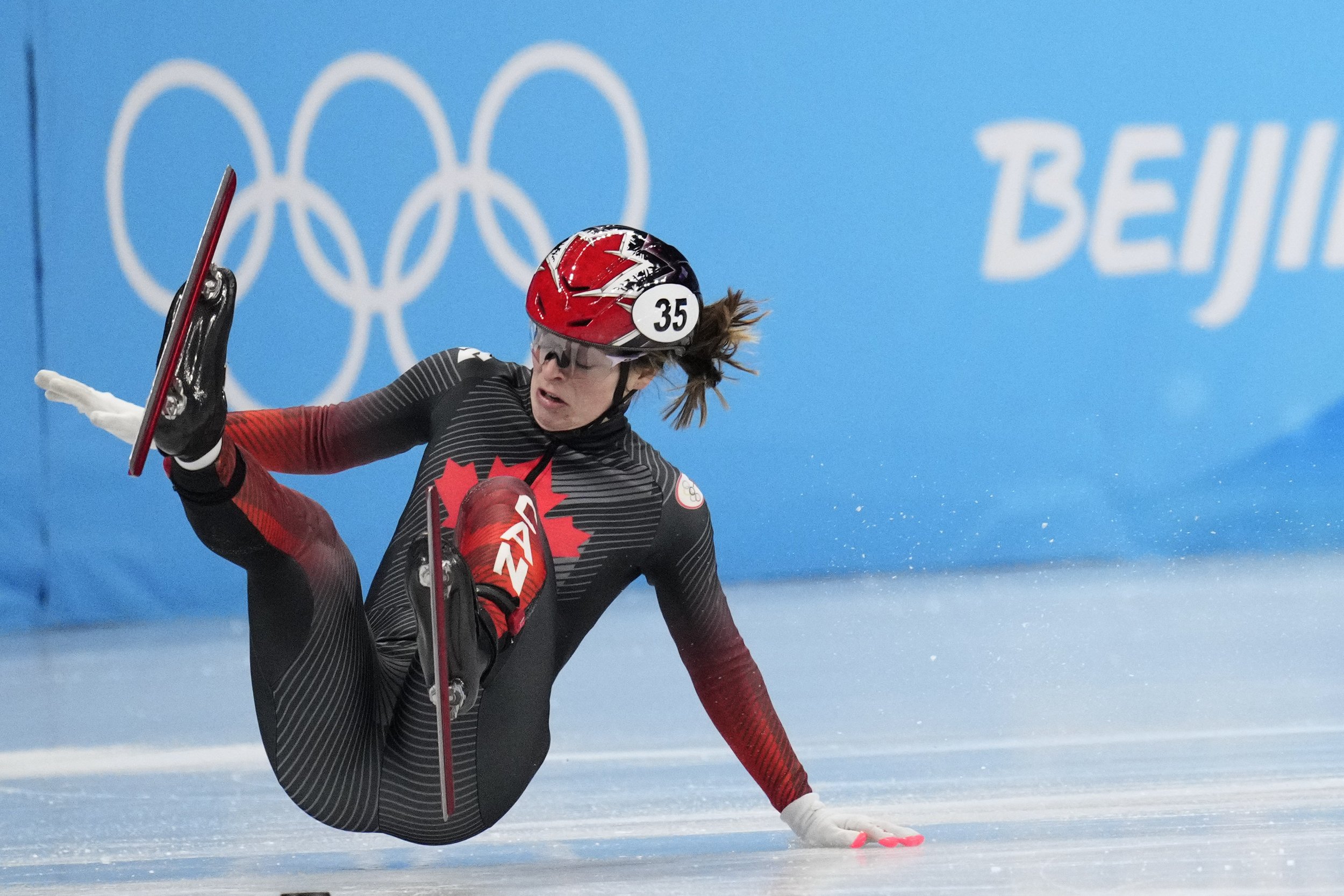  Kim Boutin of Canada, falls in her heat of the women's 1000-meters during the short track speedskating competition at the 2022 Winter Olympics, Wednesday, Feb. 9, 2022, in Beijing. (AP Photo/Bernat Armangue) 