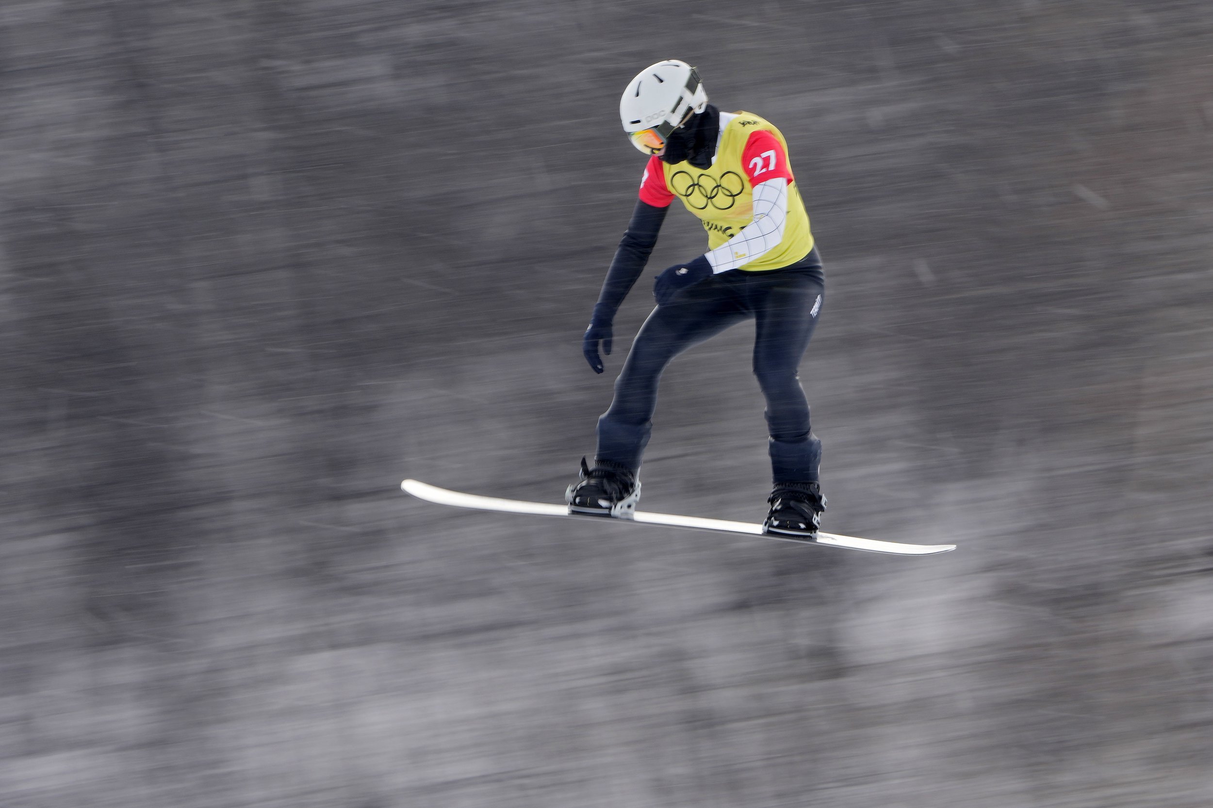  Ekaterina Lokteva-Zagorskaia, of the Russian Olympic Committee, competes during the women's snowboard cross finals at the 2022 Winter Olympics, Wednesday, Feb. 9, 2022, in Zhangjiakou, China. (AP Photo/Aaron Favila) 