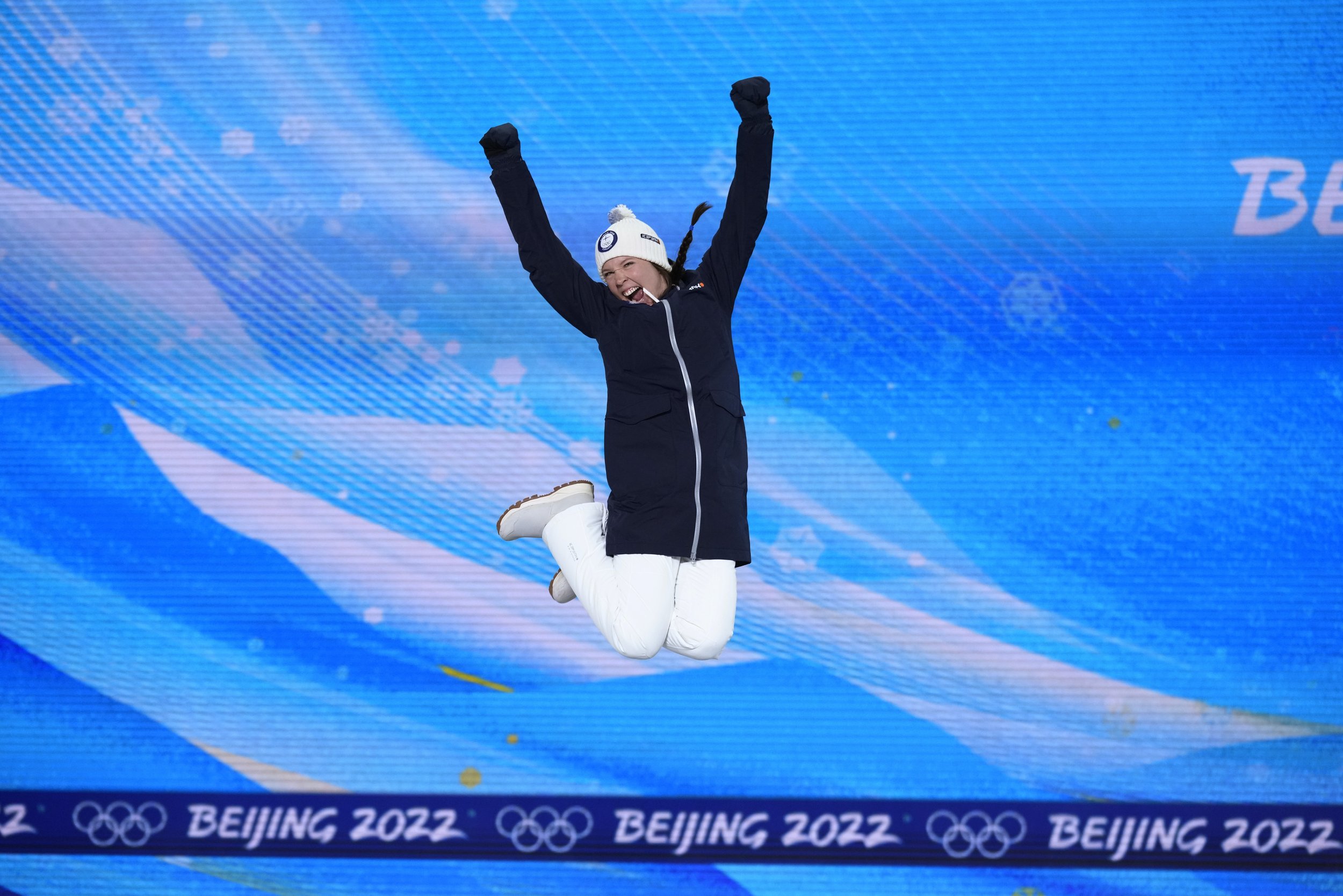  Kerttu Niskanen of Finland jumps during introductions during a medal ceremony for the women's cross-country 10-kilometer event at the 2022 Winter Olympics, Thursday, Feb. 10, 2022, in Zhangjiakou, China. (AP Photo/Kirsty Wigglesworth) 