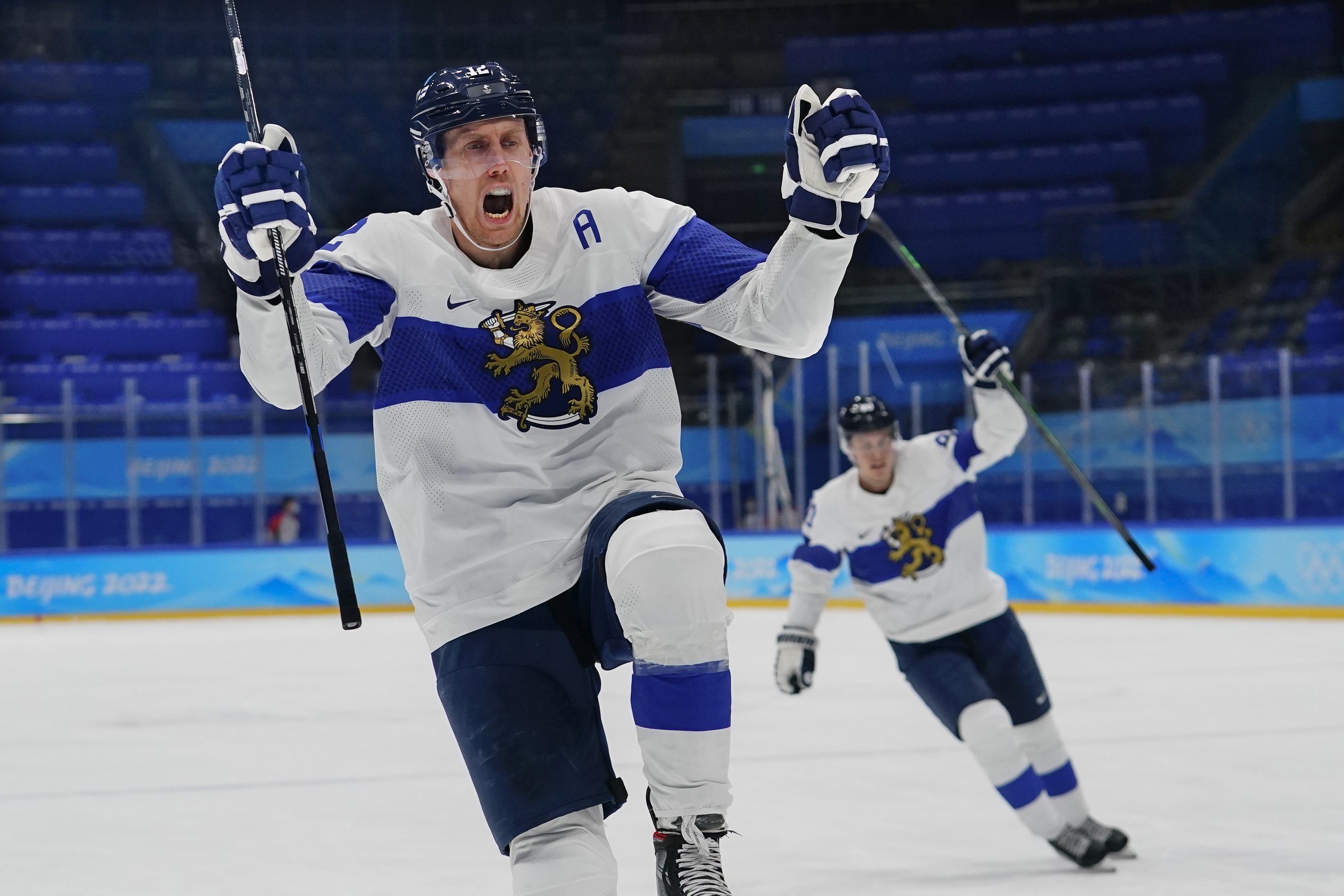  Finland's Marko Anttila, left, celebrates after scoring a goal against Latvia during a preliminary round men's hockey game at the 2022 Winter Olympics, Friday, Feb. 11, 2022, in Beijing. (AP Photo/Matt Slocum) 