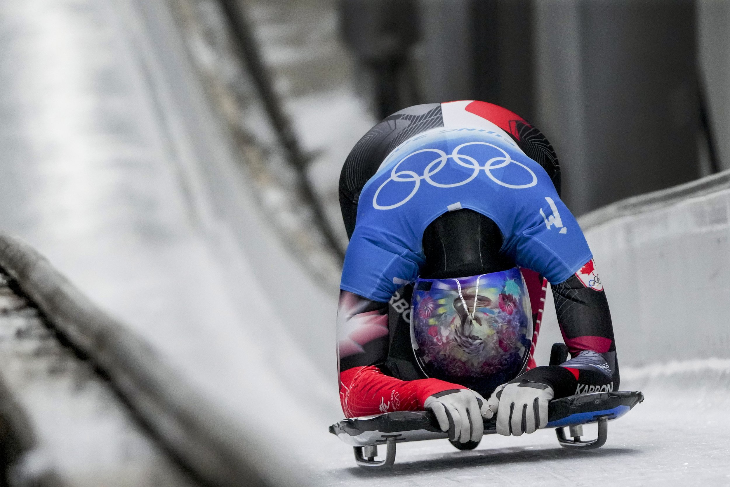  Mirela Rahneva, of Canada, looks down after the women's skeleton run 4 at the 2022 Winter Olympics, Saturday, Feb. 12, 2022, in the Yanqing district of Beijing. (AP Photo/Pavel Golovkin) 