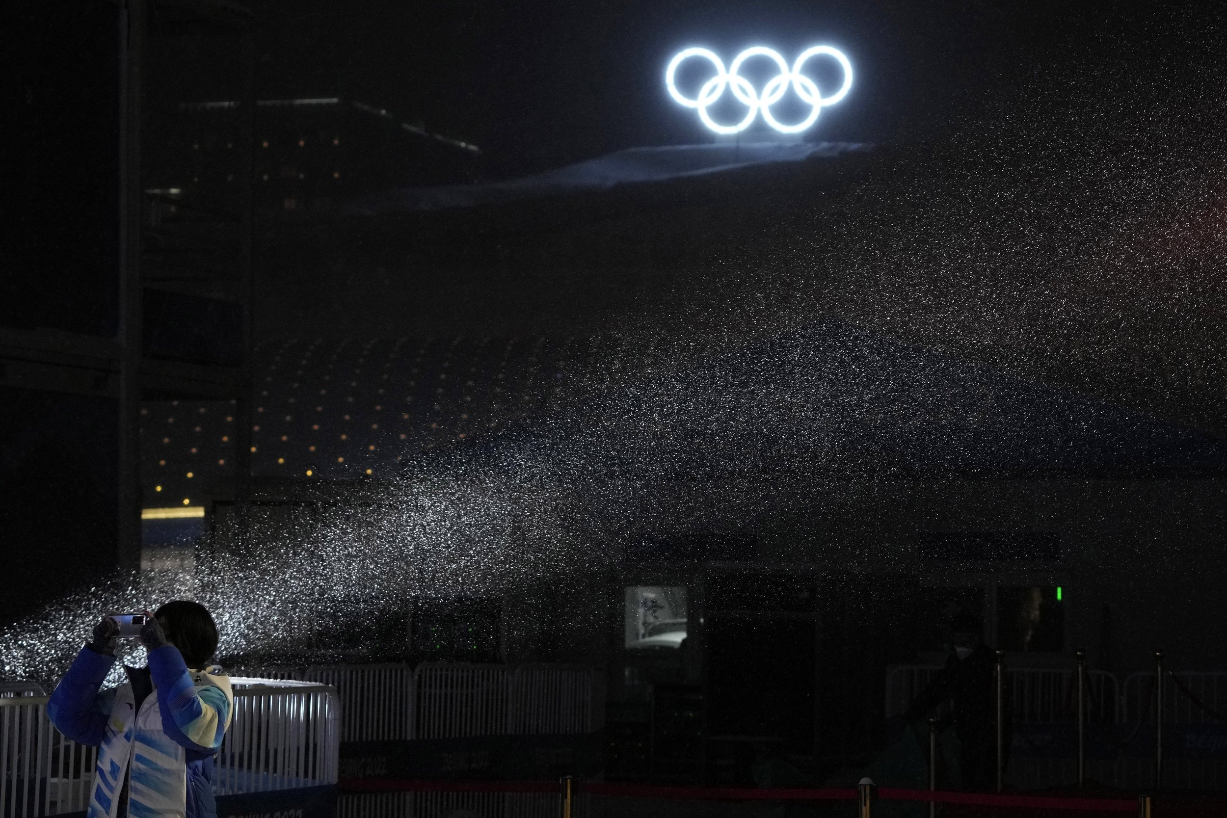  Snow falls after a medal ceremony at the 2022 Winter Olympics, Sunday, Feb. 13, 2022, in Zhangjiakou, China. (AP Photo/Aaron Favila) 