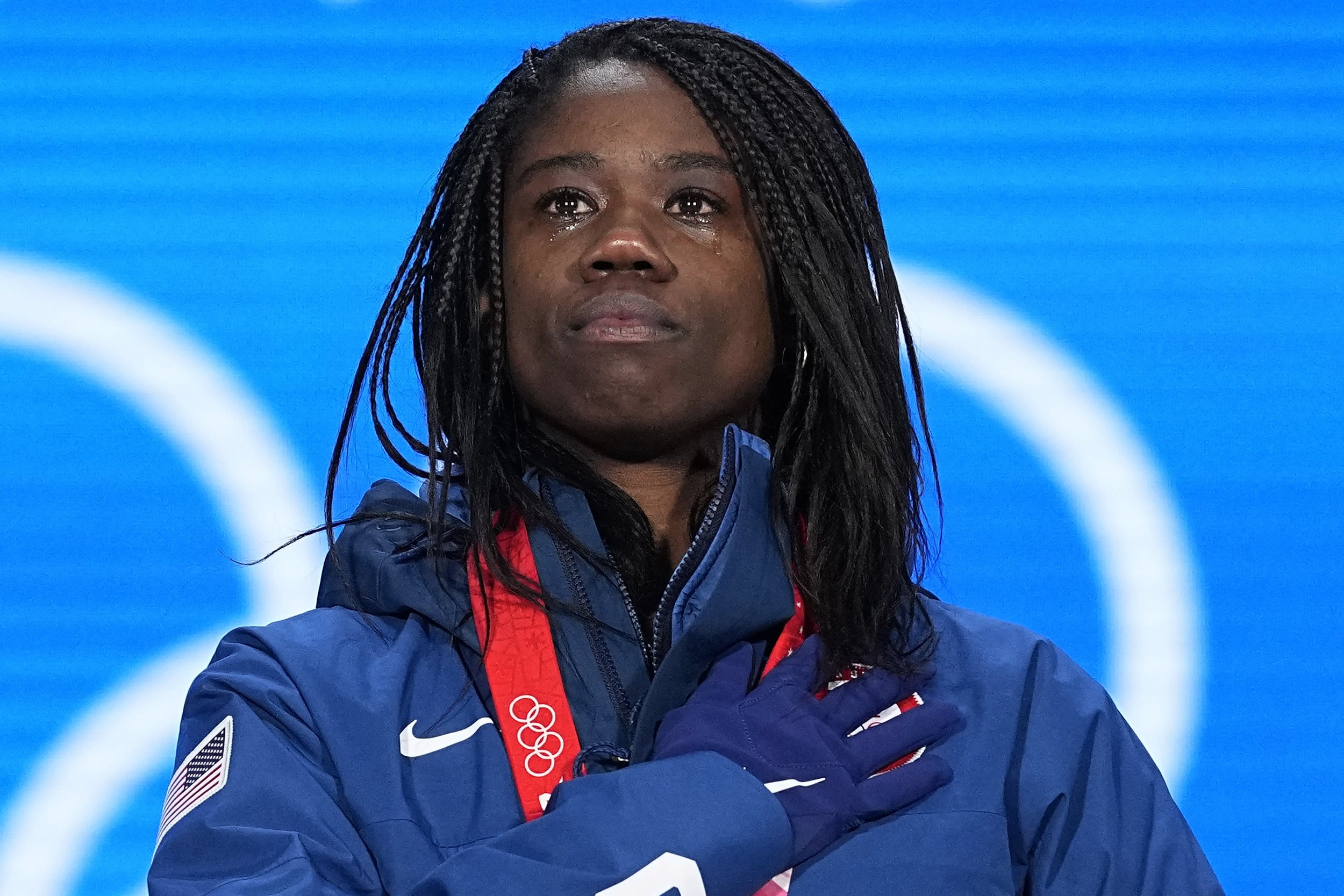  Gold medalist Erin Jackson of the United States stands for her national anthem during the medal ceremony for the speedskating women's 500-meter race at the 2022 Winter Olympics, Monday, Feb. 14, 2022, in Beijing. (AP Photo/Sue Ogrocki) 