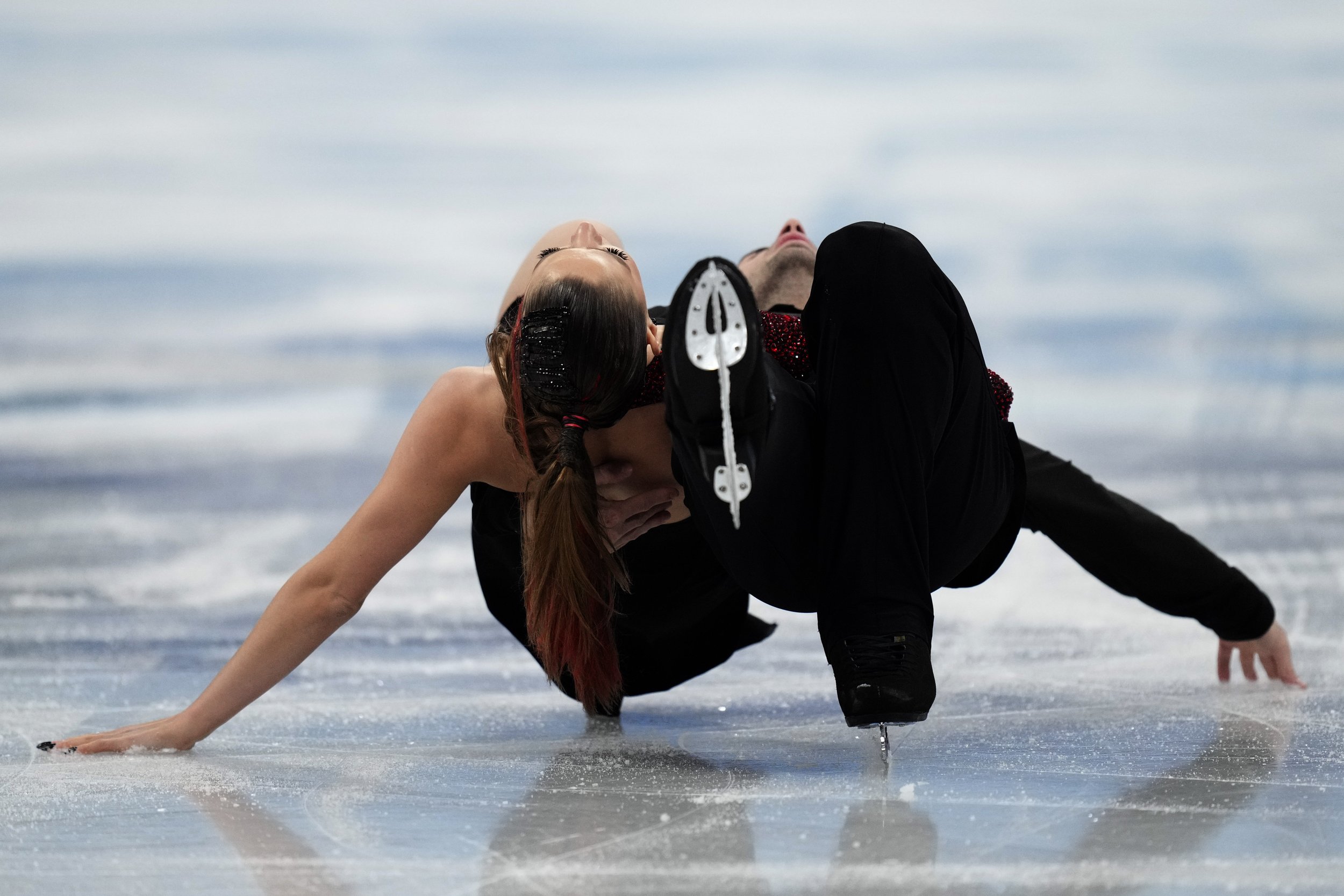 Oleksandra Nazarova and Maksym Nikitin, of Ukraine, perform their routine in the ice dance competition during the figure skating at the 2022 Winter Olympics, Monday, Feb. 14, 2022, in Beijing. (AP Photo/Bernat Armangue) 