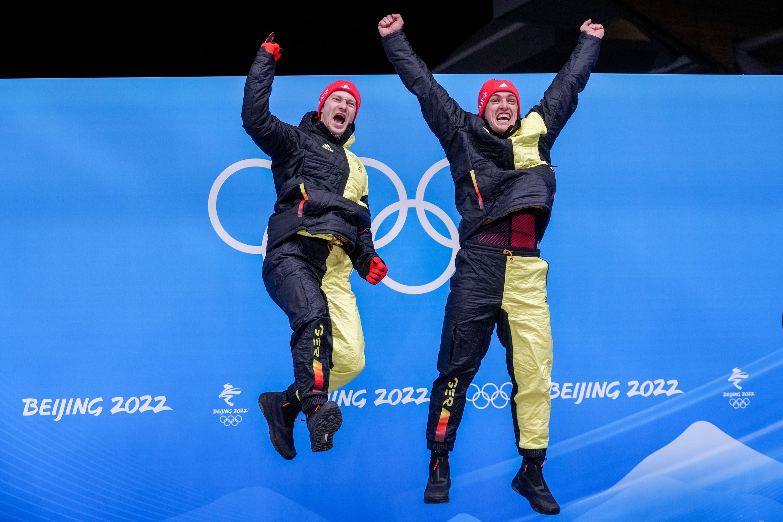  Francesco Friedrich and Thorsten Margis, of Germany, celebrate winning the gold medal in the 2-man at the 2022 Winter Olympics, Tuesday, Feb. 15, 2022, in the Yanqing district of Beijing. (AP Photo/Dmitri Lovetsky) 