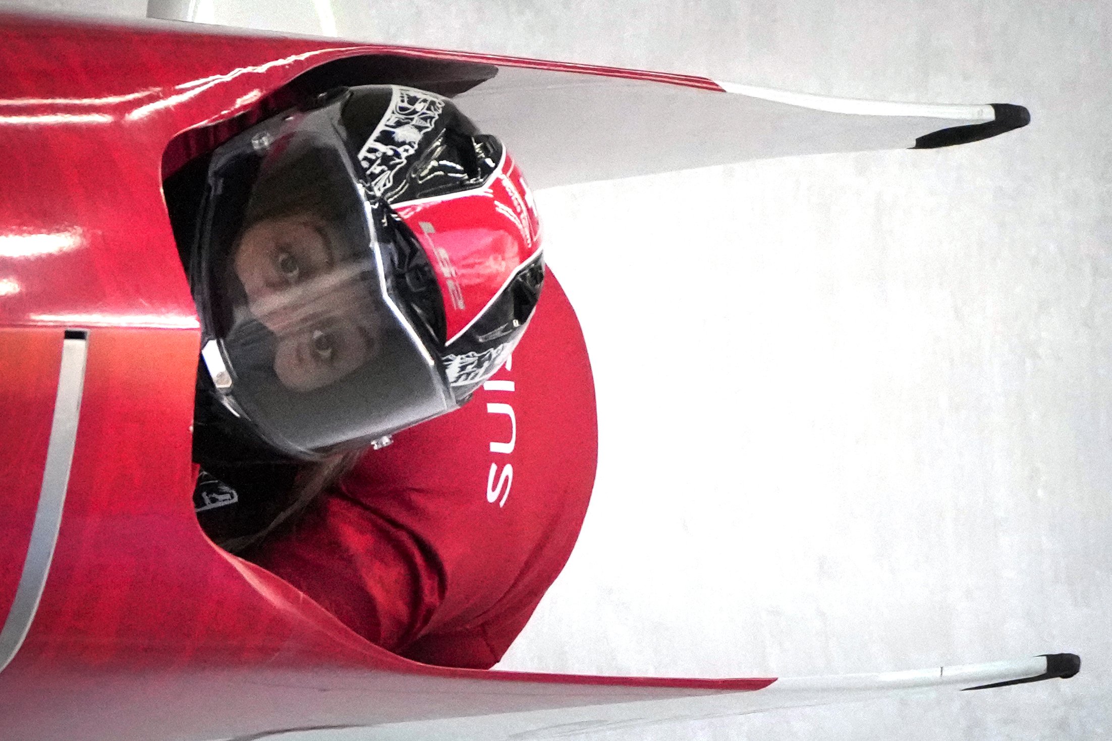  Melanie Hasler of Switzerland speeds down the track during a 2-woman bobsled training at the 2022 Winter Olympics, Tuesday, Feb. 15, 2022, in the Yanqing district of Beijing. (AP Photo/Mark Schiefelbein) 