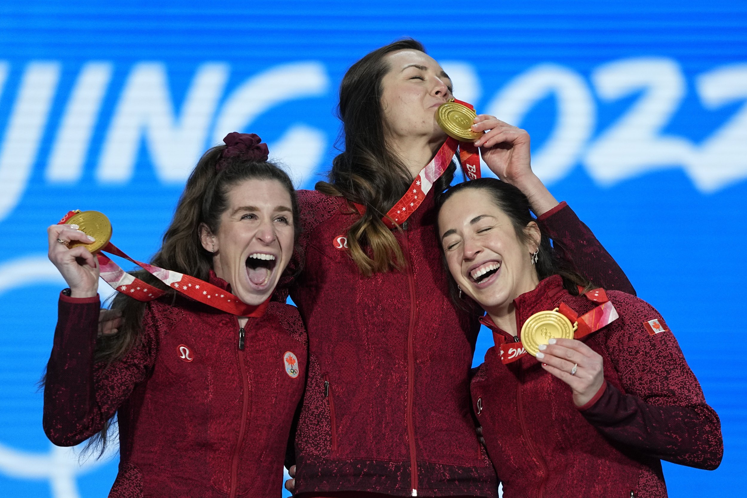  Gold medal winner Team Canada celebrates during a medal ceremony for the speedskating women's team pursuit at the 2022 Winter Olympics, Tuesday, Feb. 15, 2022, in Beijing. (AP Photo/Jae C. Hong) 