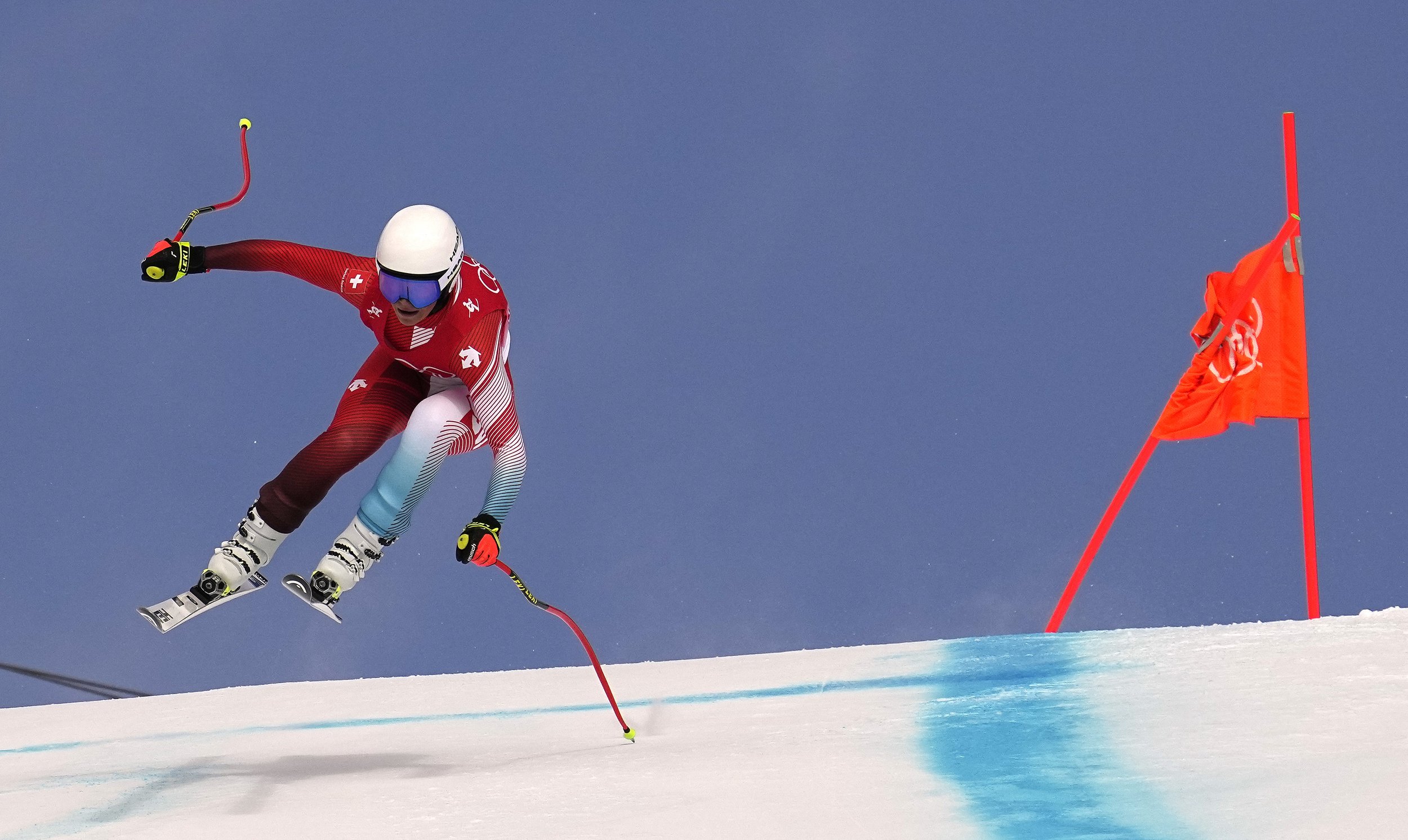  Corinne Suter, of Switzerland makes a jump during the women's downhill at the 2022 Winter Olympics, Tuesday, Feb. 15, 2022, in the Yanqing district of Beijing. (AP Photo/Robert F. Bukaty) 
