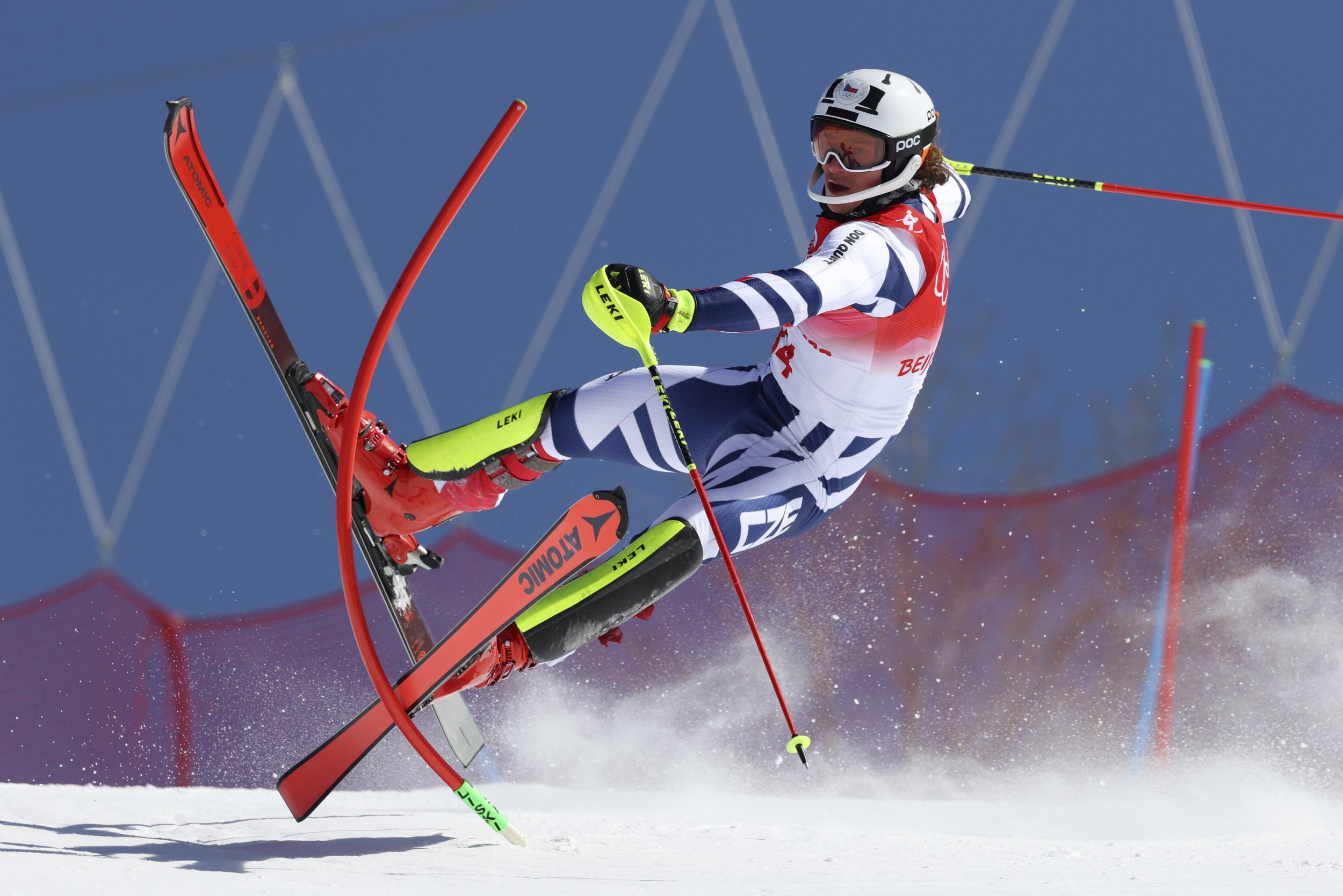  Jan Zabystran, of Czech Republic crashes out during the first run of the men's slalom at the 2022 Winter Olympics, Wednesday, Feb. 16, 2022, in the Yanqing district of Beijing. (AP Photo/Alessandro Trovati) 
