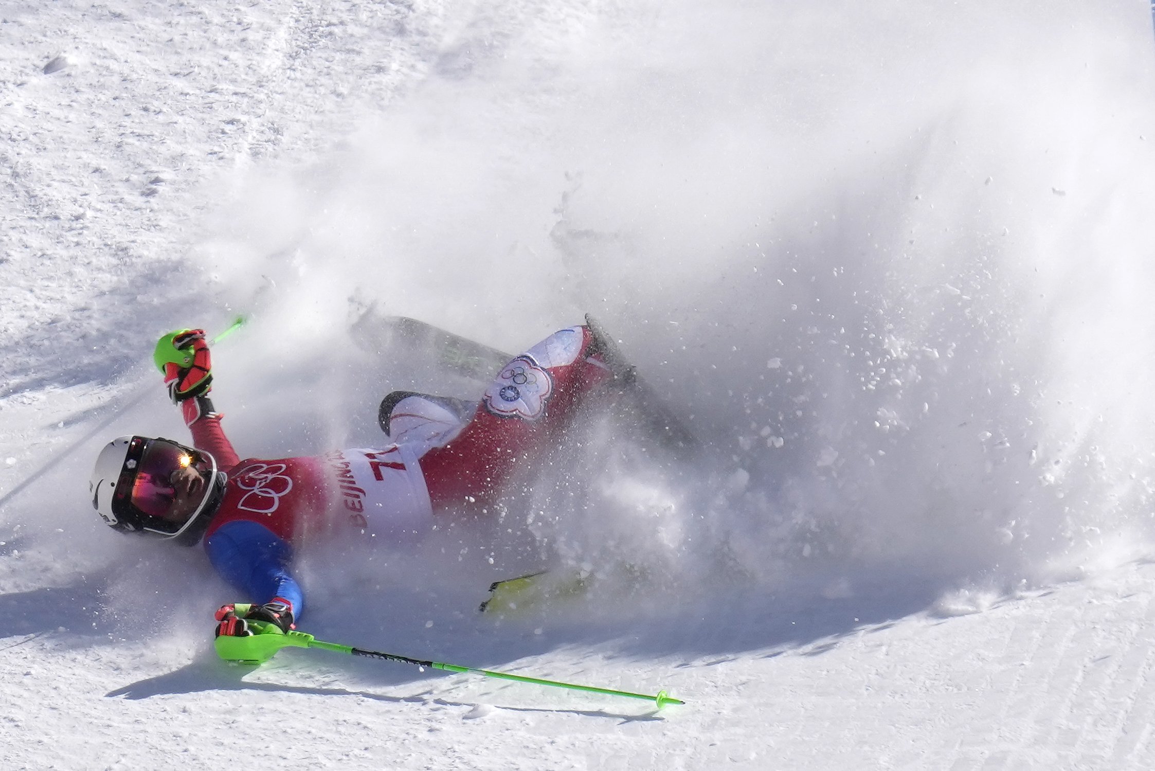  Ho Ping-jui, of Taiwan crashes out during the first run of the men's slalom at the 2022 Winter Olympics, Wednesday, Feb. 16, 2022, in the Yanqing district of Beijing. (AP Photo/Luca Bruno) 