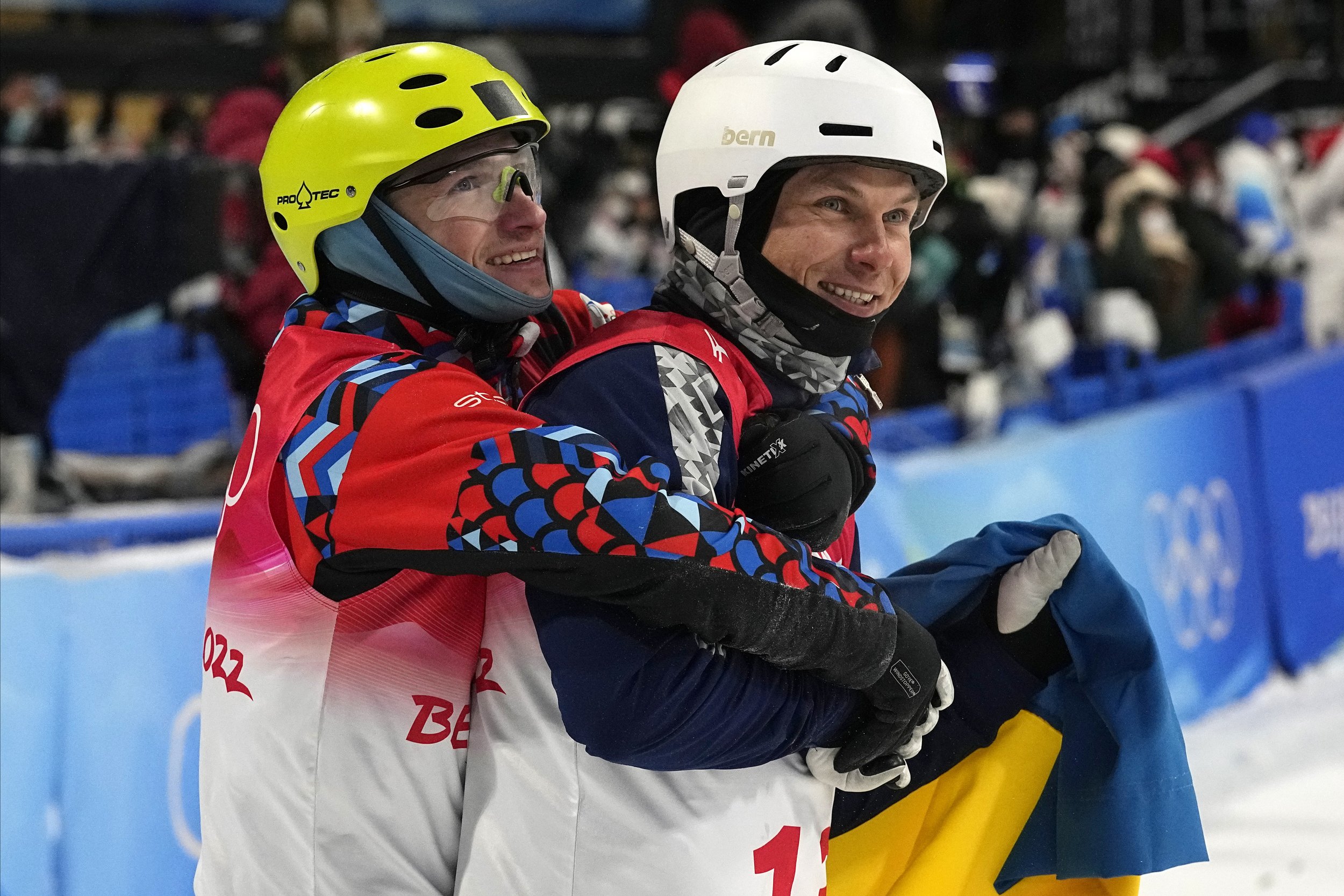  Bronze medal winner Ilia Burov, of the Russian Olympic Committee, left, hugs silver medal winner Ukraine's Oleksandr Abramenko as they celebrate after the men's aerials finals at the 2022 Winter Olympics, Wednesday, Feb. 16, 2022, in Zhangjiakou, Ch