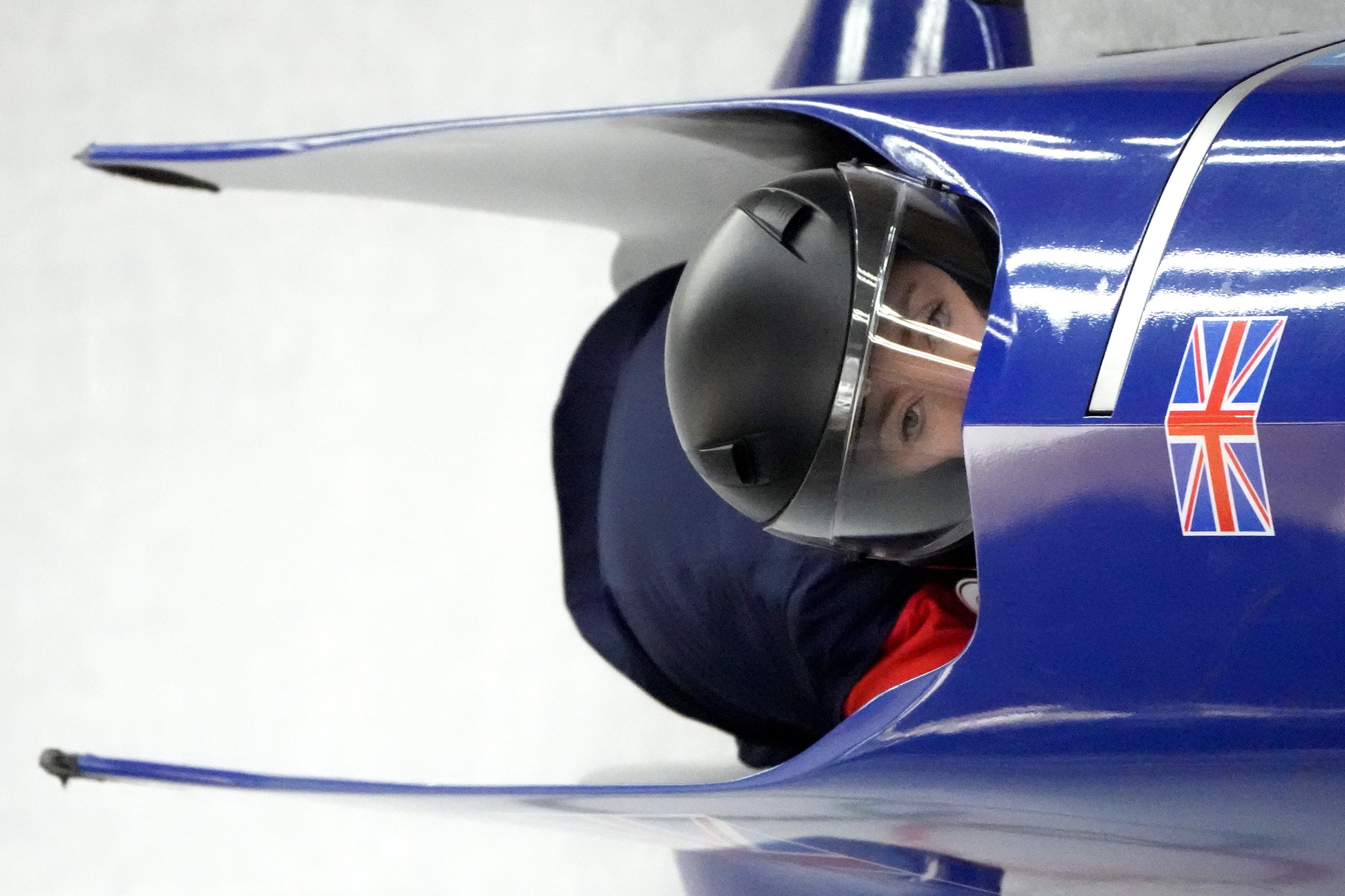  Mica McNeill of Britain speeds along the track during a 2-woman bobsled training at the 2022 Winter Olympics, Wednesday, Feb. 16, 2022, in the Yanqing district of Beijing. (AP Photo/Mark Schiefelbein) 
