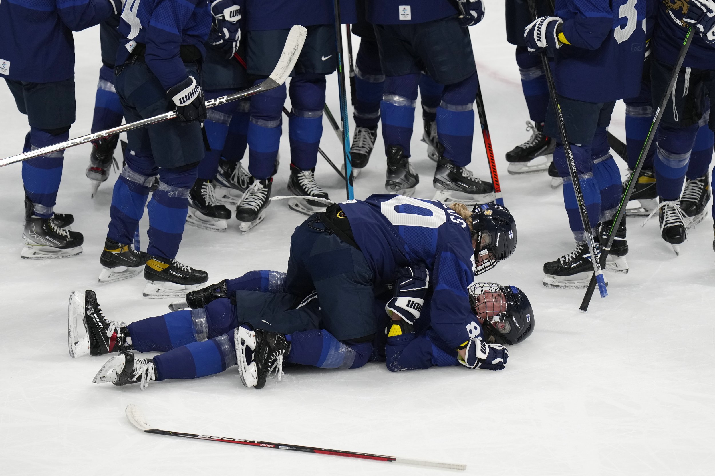  Finland celebrates after beating Switzerland in the women's bronze medal hockey game at the 2022 Winter Olympics, Wednesday, Feb. 16, 2022, in Beijing. (AP Photo/Petr David Josek) 