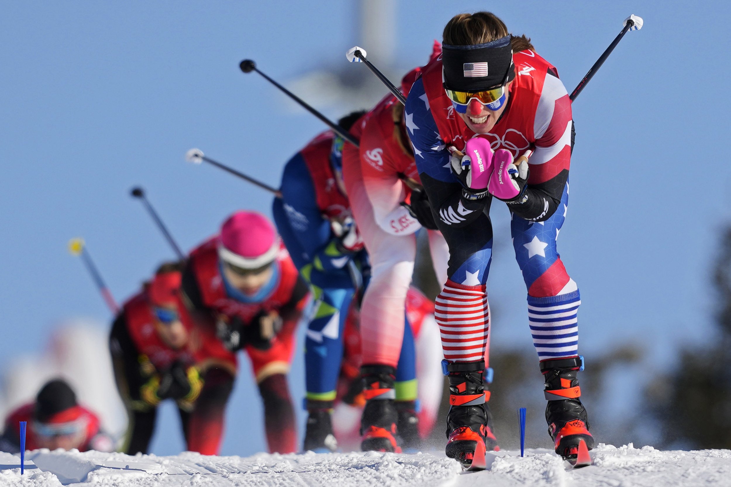  Rosie Brennan leads a group during the women's team sprint classic cross-country skiing competition at the 2022 Winter Olympics, Wednesday, Feb. 16, 2022, in Zhangjiakou, China. (AP Photo/Aaron Favila) 