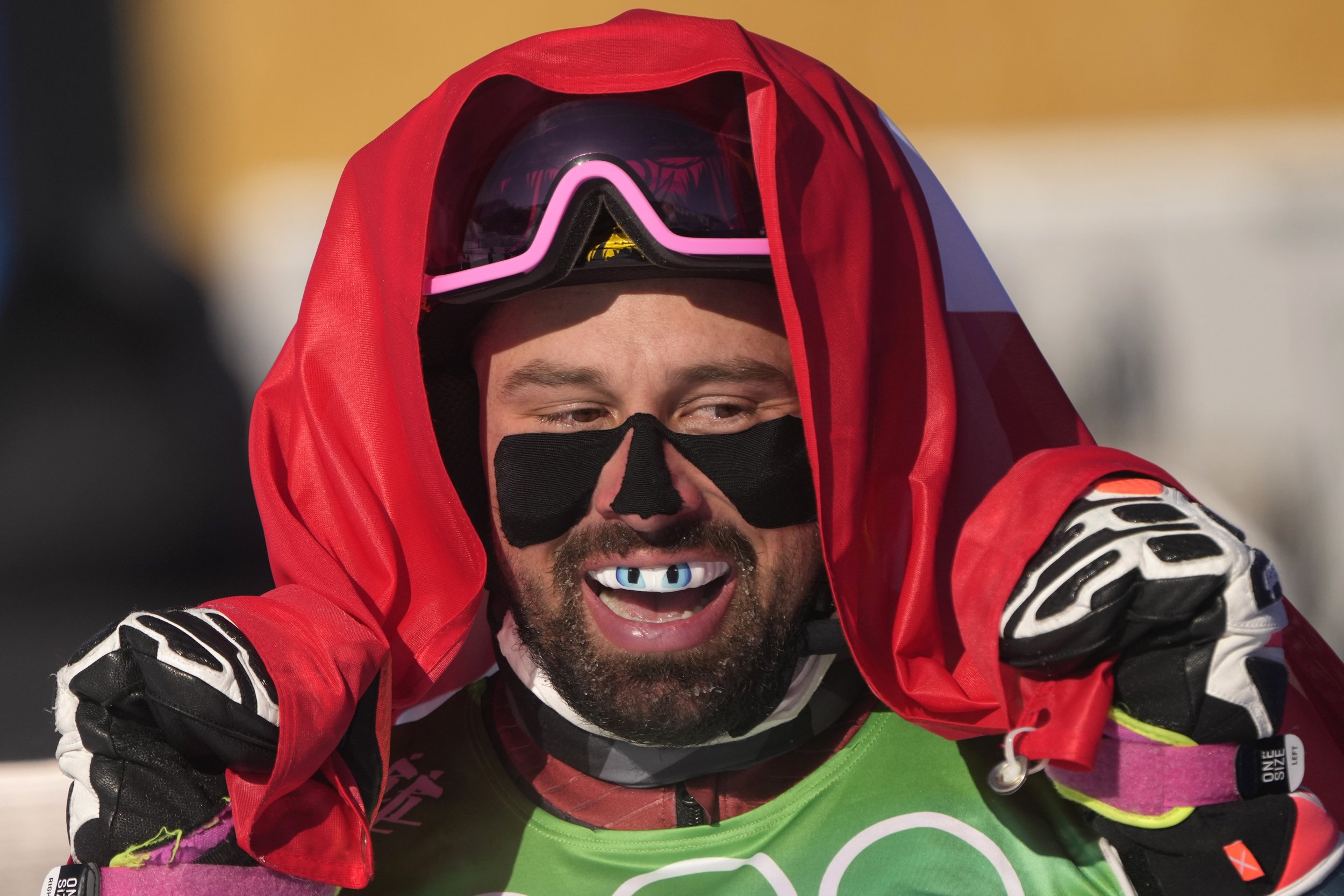  Switzerland's Ryan Regez celebrates after winning a gold medal in the men's cross at the 2022 Winter Olympics, Friday, Feb. 18, 2022, in Zhangjiakou, China. (AP Photo/Francisco Seco) 