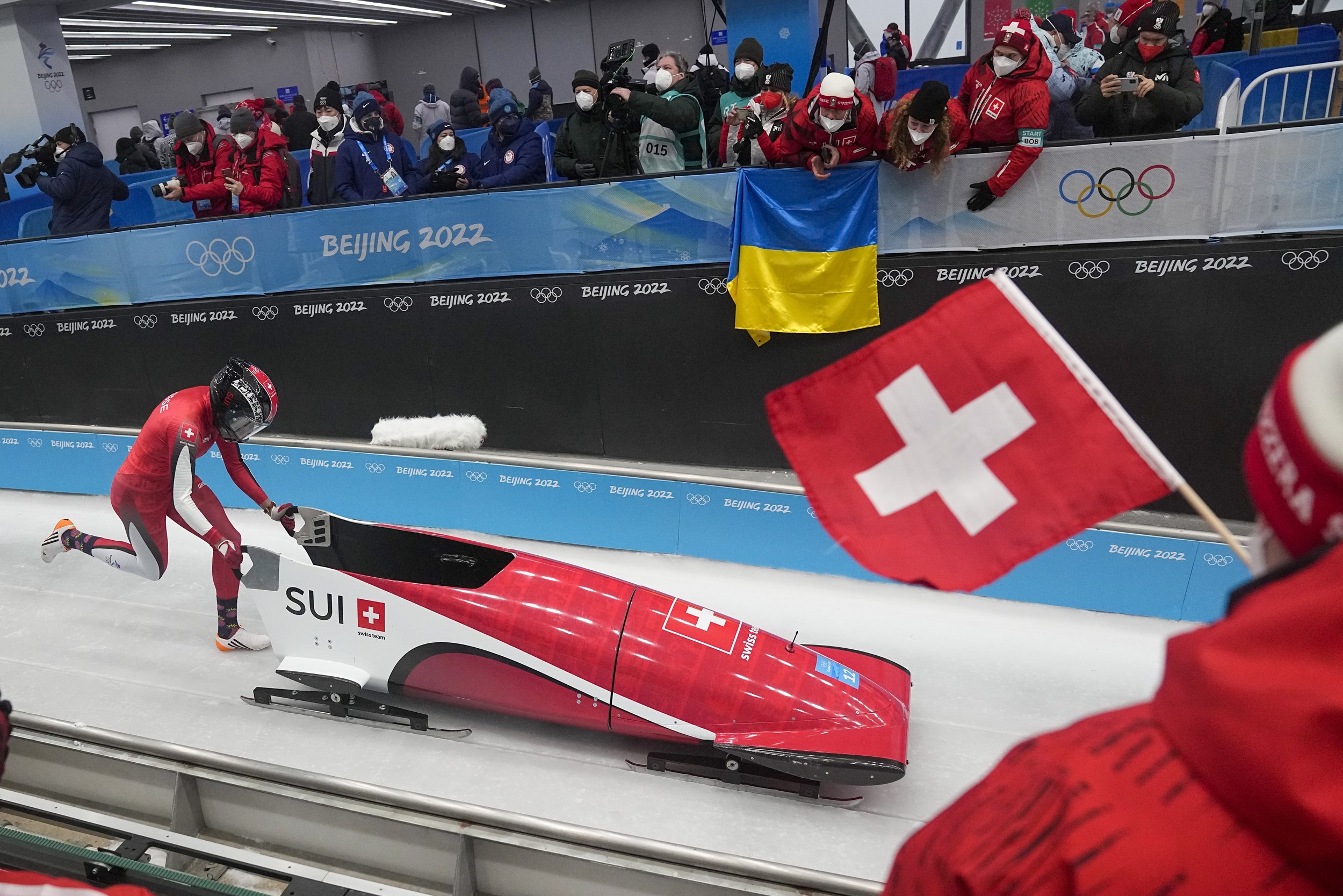  Melanie Hasler, of Switzerland, drives her bobsled during women's monobob heat 1 at the 2022 Winter Olympics, Sunday, Feb. 13, 2022, in the Yanqing district of Beijing. (AP Photo/Pavel Golovkin) 
