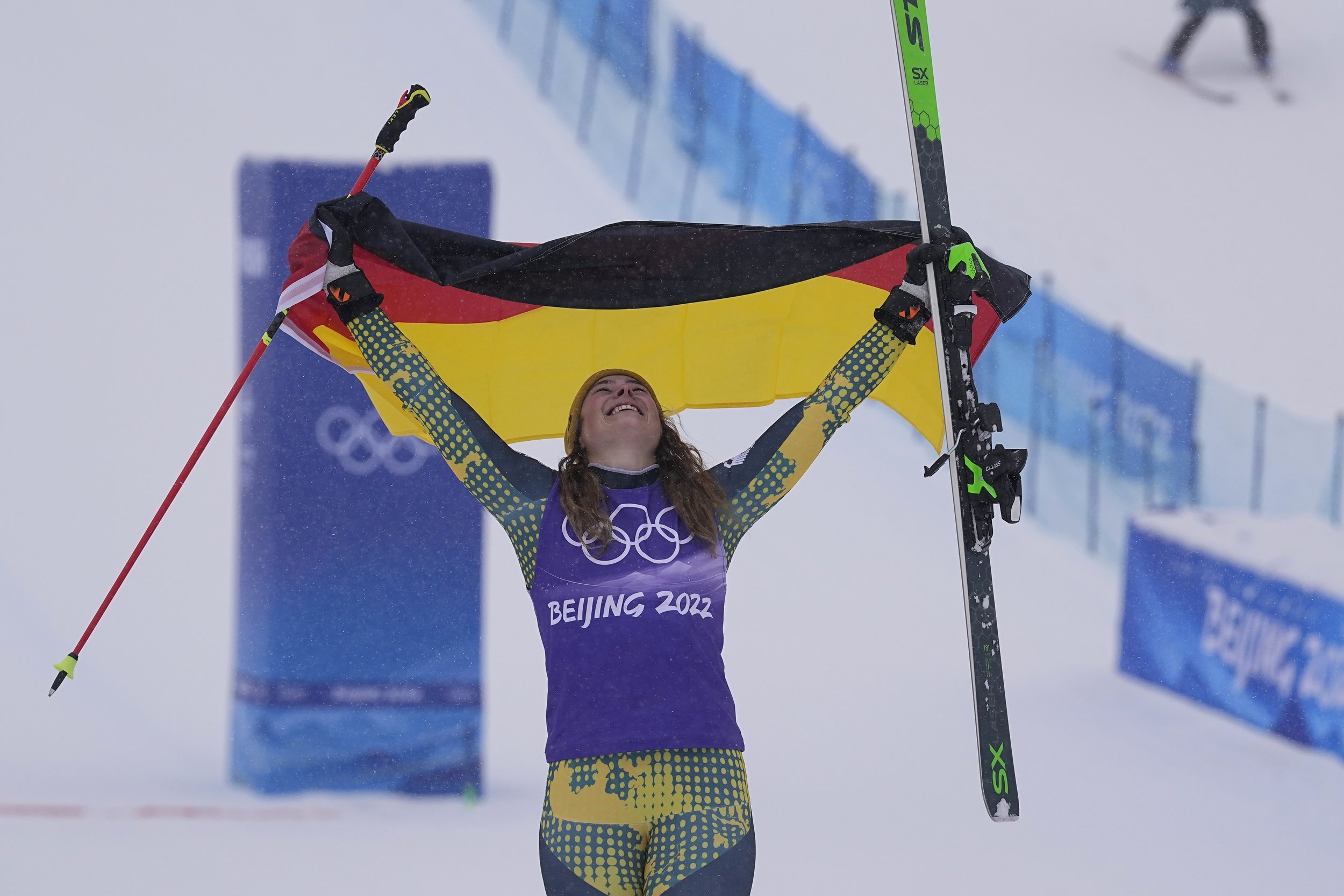  Bronze medal winner Germany's Daniela Maier celebrates during the venue award ceremony for the women's cross at the 2022 Winter Olympics, Thursday, Feb. 17, 2022, in Zhangjiakou, China. (AP Photo/Gregory Bull) 