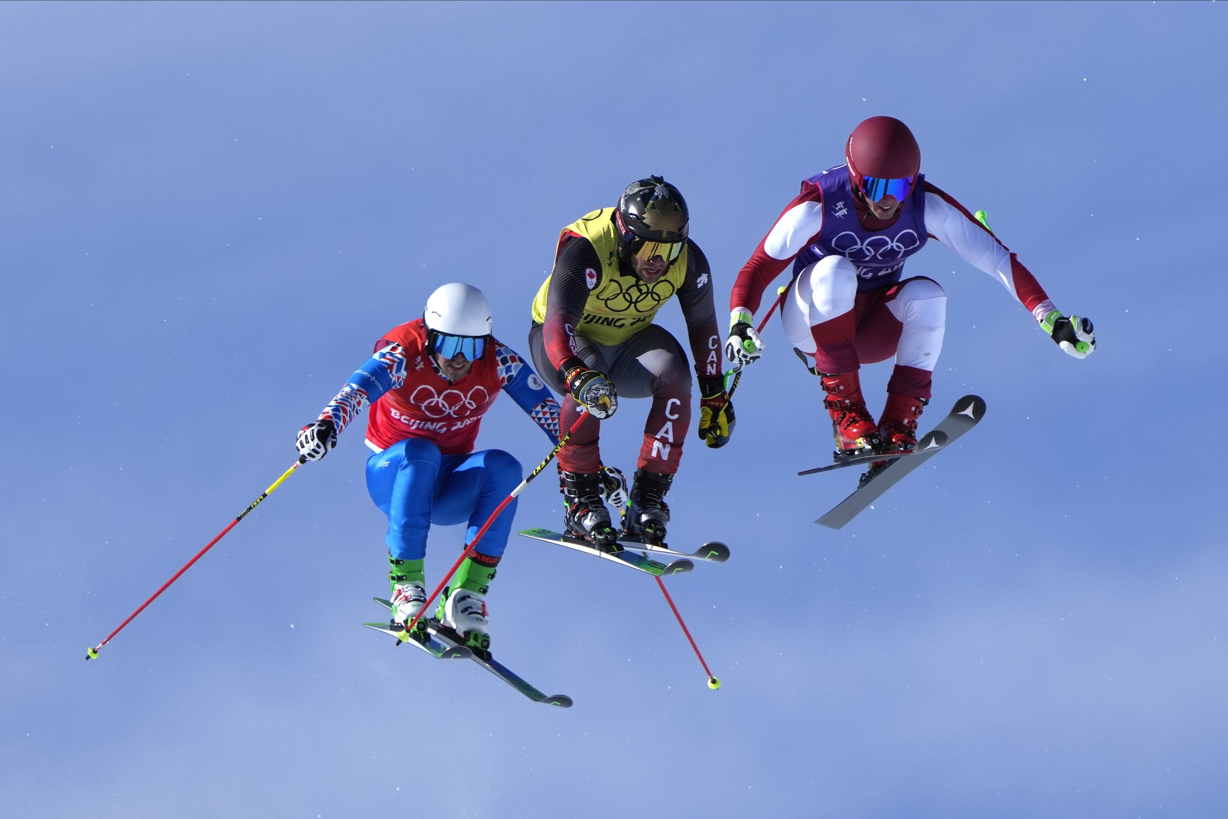  Austria's Johannes Rohrweck, right, Canada's Kevin Drury and Igor Omelin, of the Russian Olympic Committee, competes during the men's cross finals at the 2022 Winter Olympics, Friday, Feb. 18, 2022, in Zhangjiakou, China. (AP Photo/Lee Jin-man) 
