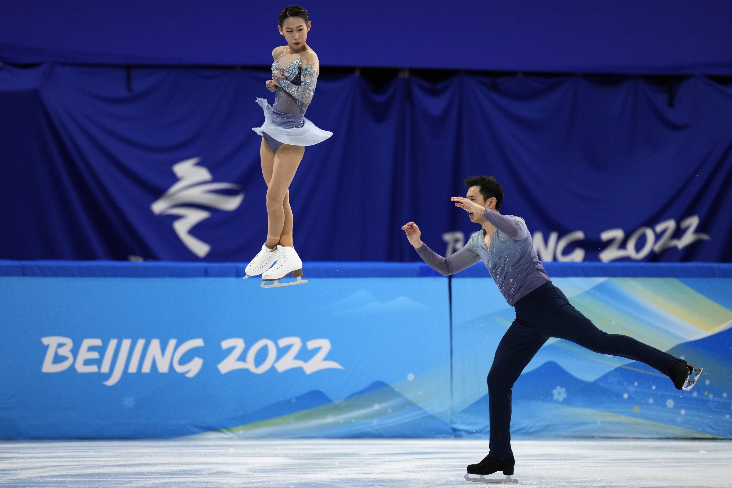  Peng Cheng and Jin Yang, of China, compete in the pairs short program during the figure skating competition at the 2022 Winter Olympics, Friday, Feb. 18, 2022, in Beijing. (AP Photo/Bernat Armangue) 